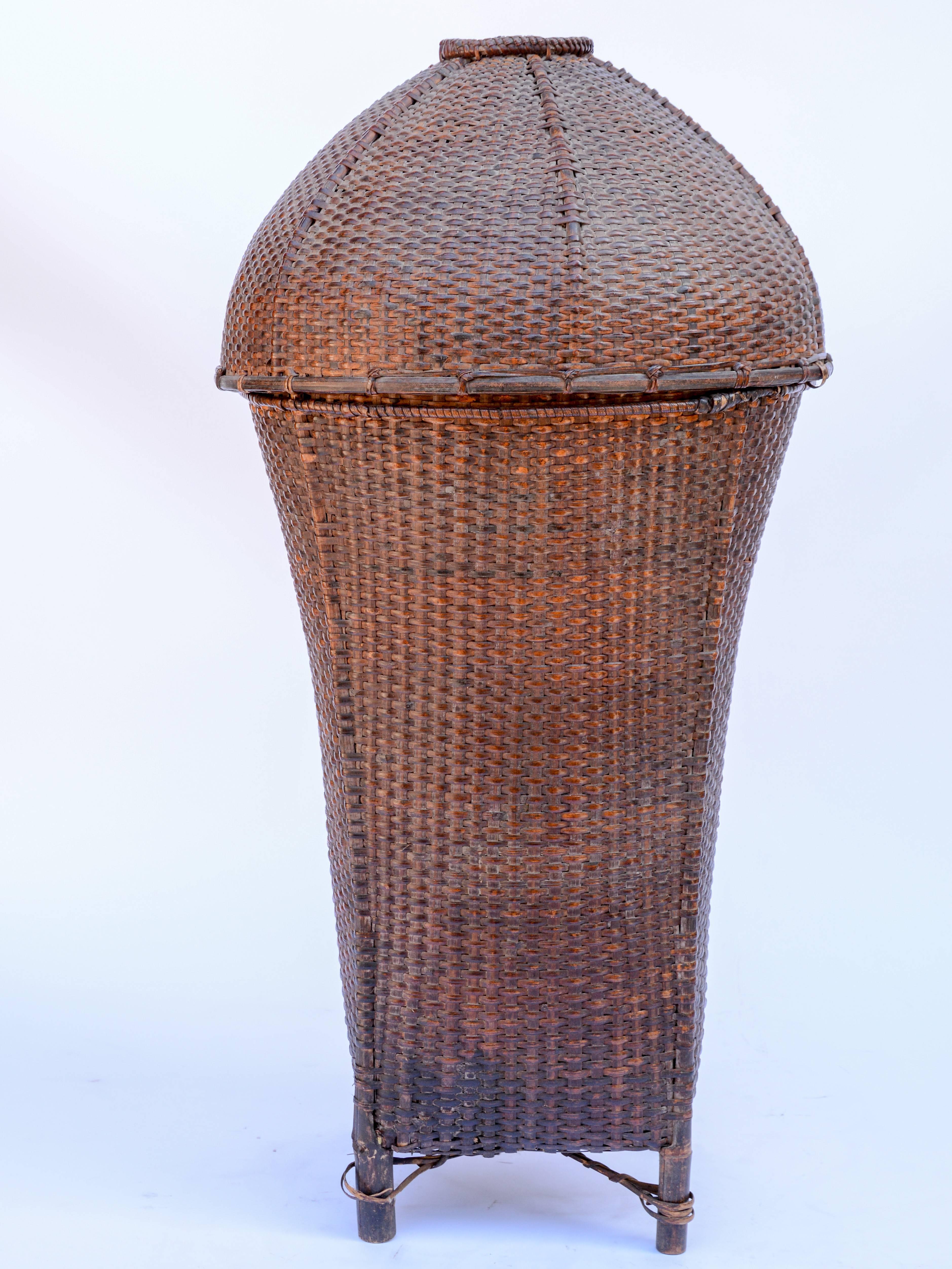 Vintage storage basket with Domed Lid. Rawang people of Burma, mid-20th century, bamboo
Offered by Bruce Hughes.
This large footed basket would have been used to transport and store household items - textiles and other valuables. It comes from the