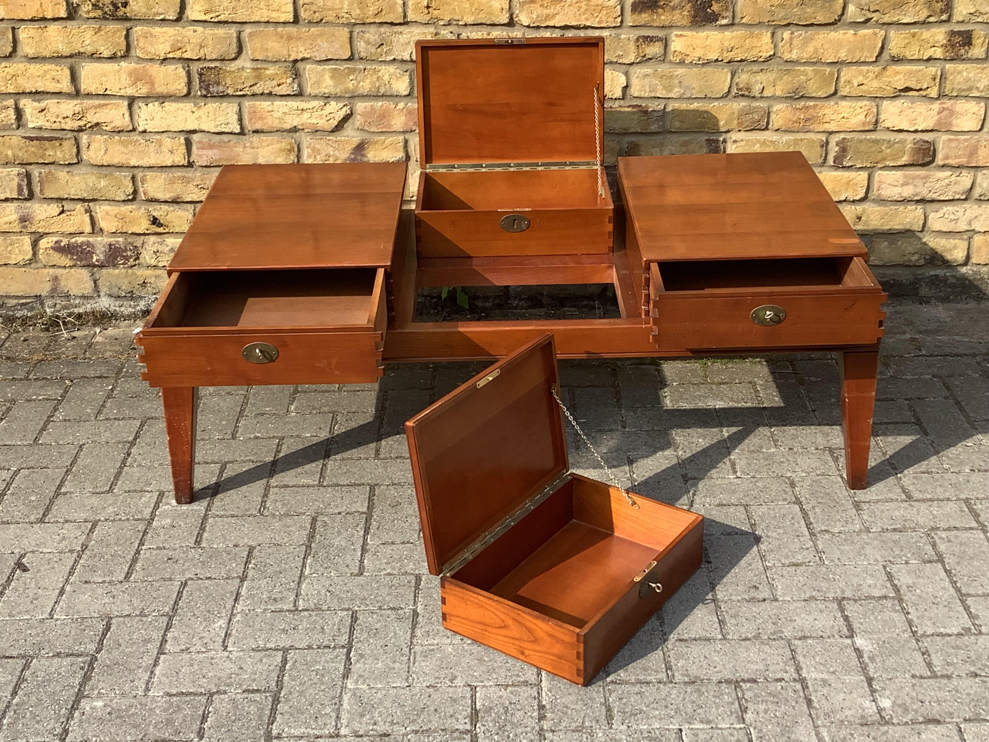 Limited edition coffee table with removable storage boxes unusual
and practical piece of furniture 
two of the boxes are lockable

1980-1990