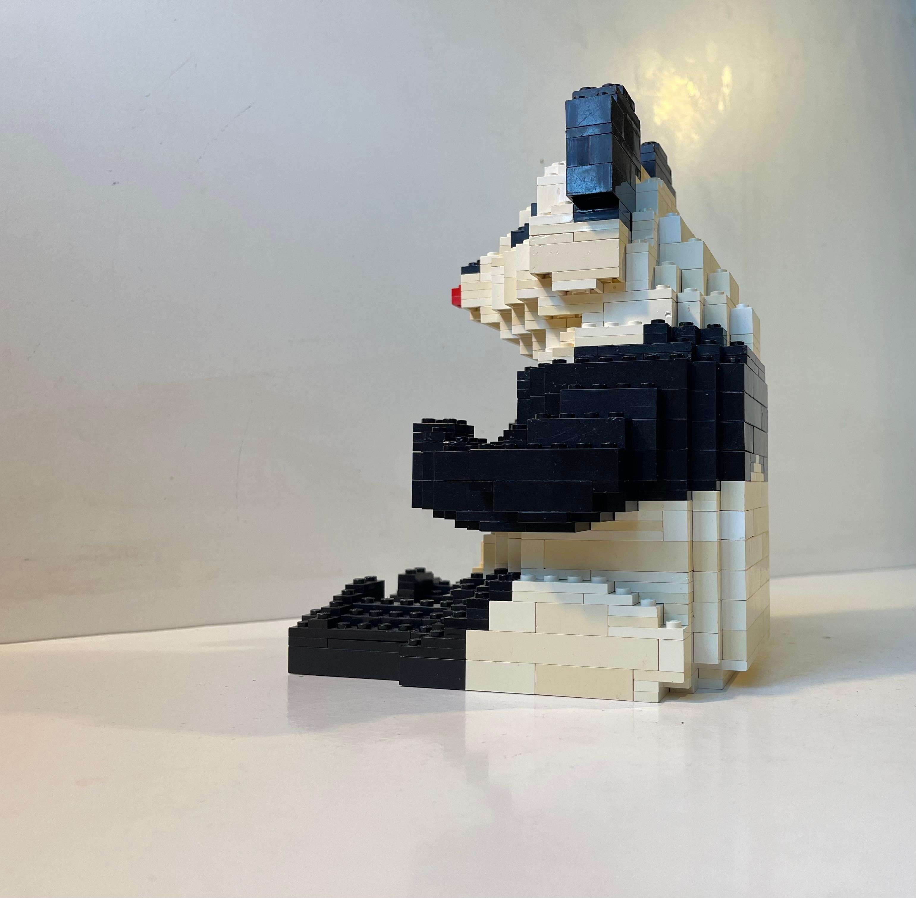 Large Panda figurine made from Lego blocks. It served as a toy store Zoo-line advertising display during the early 1990s. It has a great graphical and pixelated look. A physical counterpart to digitalt art. Measurements: H: 22 cm, W: 15 cm, Dept: 16