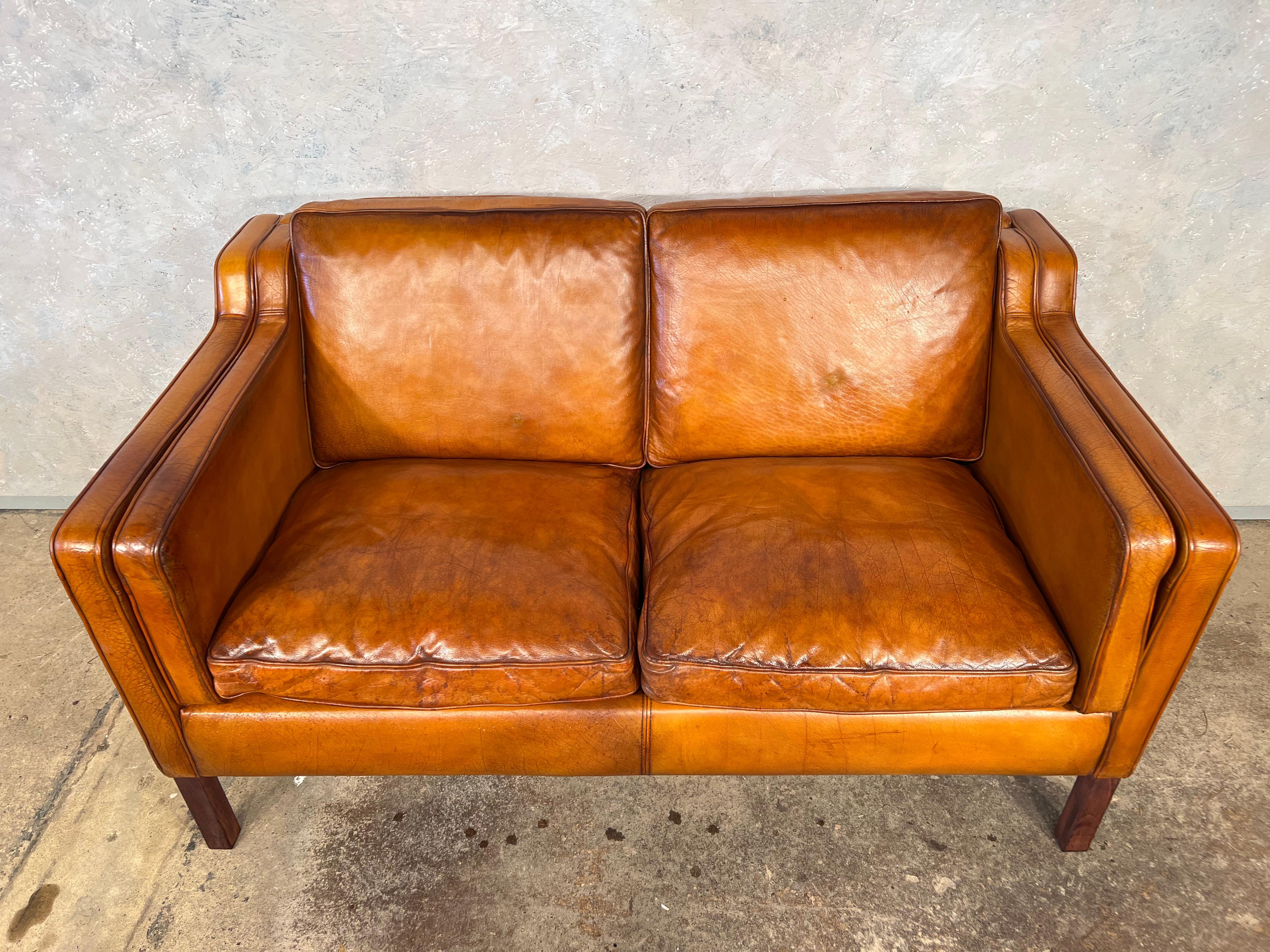 A stylish Stouby 1970s sofa, great design with beautiful lines, sits wonderfully.

Stunning hand dyed light tan colour, great patina and finish. Great quality sofa, with feather filled cushions for extra comfort.

