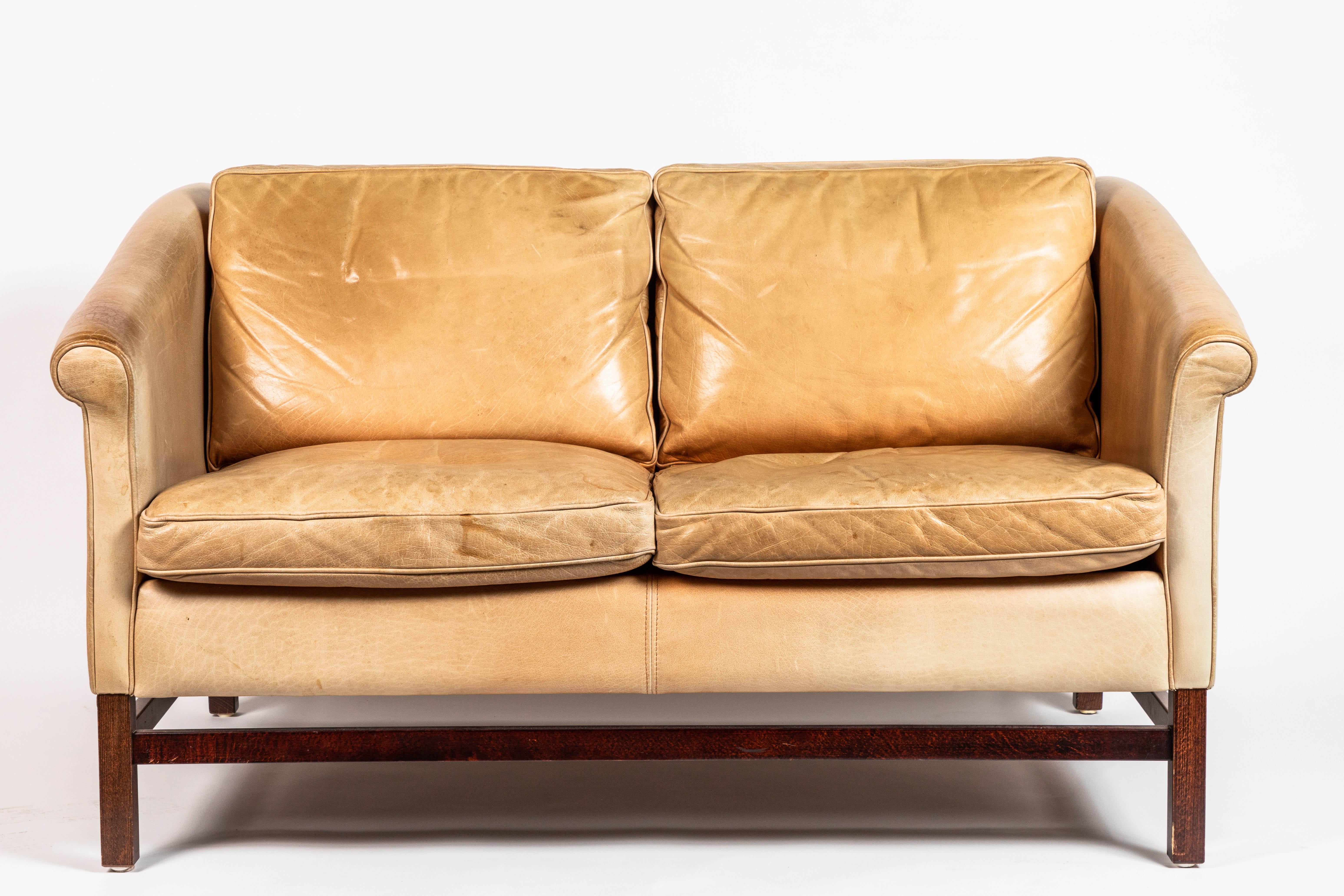 Danish leather and mahogany sofa by Stouby, in original leather, circa 1960s. Arm height: 24.5