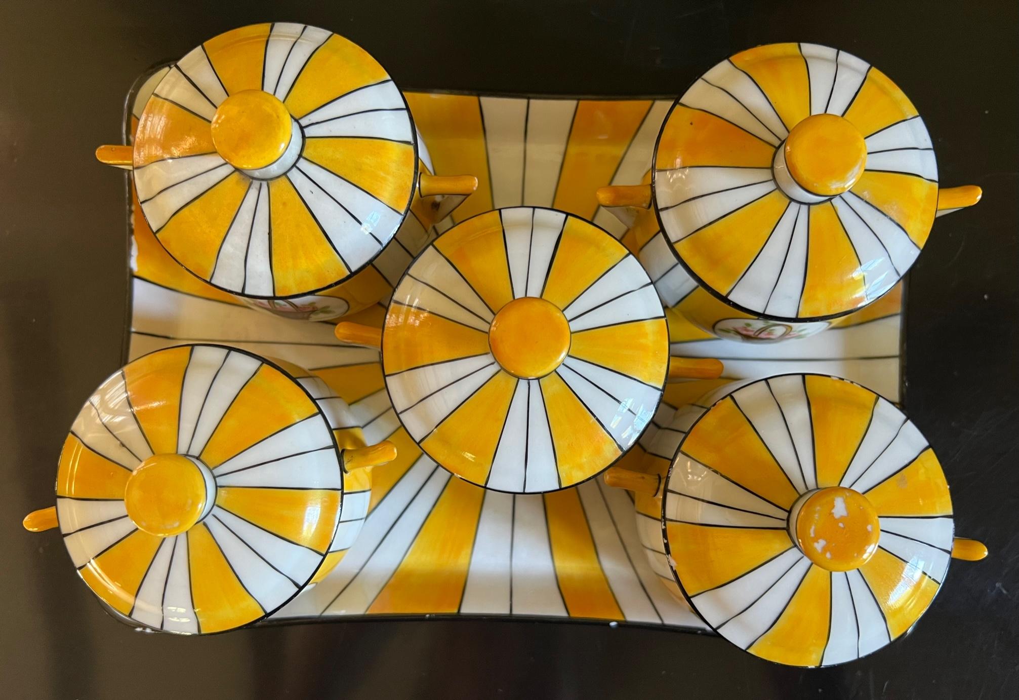 Vintage yellow and white striped cream pot set made around 1960 in Limoges, France. This set would typically used in France for desserts such as chocolate, mousse or custard.

Tray: 9.25 wide by 6.5 wide
Each pot with lid 2.75 tall, 4 inches across