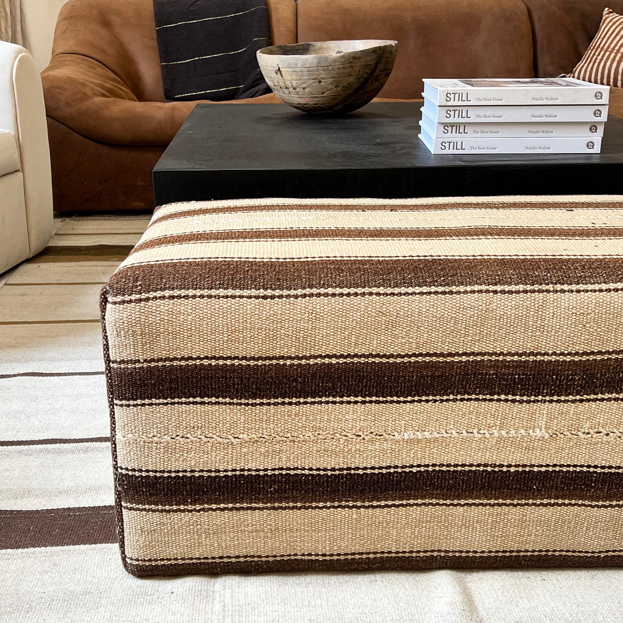 Rich striped vintage ottoman created with deconstructed vintage rug. Perfect for a cosy, liveable space.