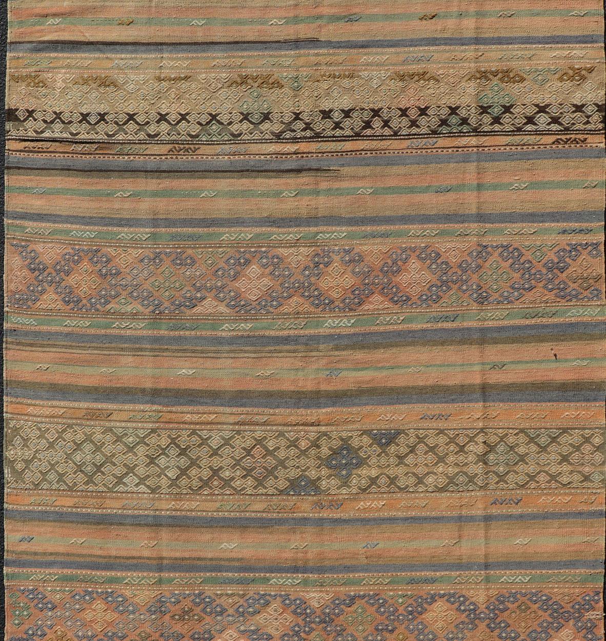 Hand-Woven Vintage Striped Turkish Kilim Rug with Geometric Shapes and Soft Muted Colors For Sale