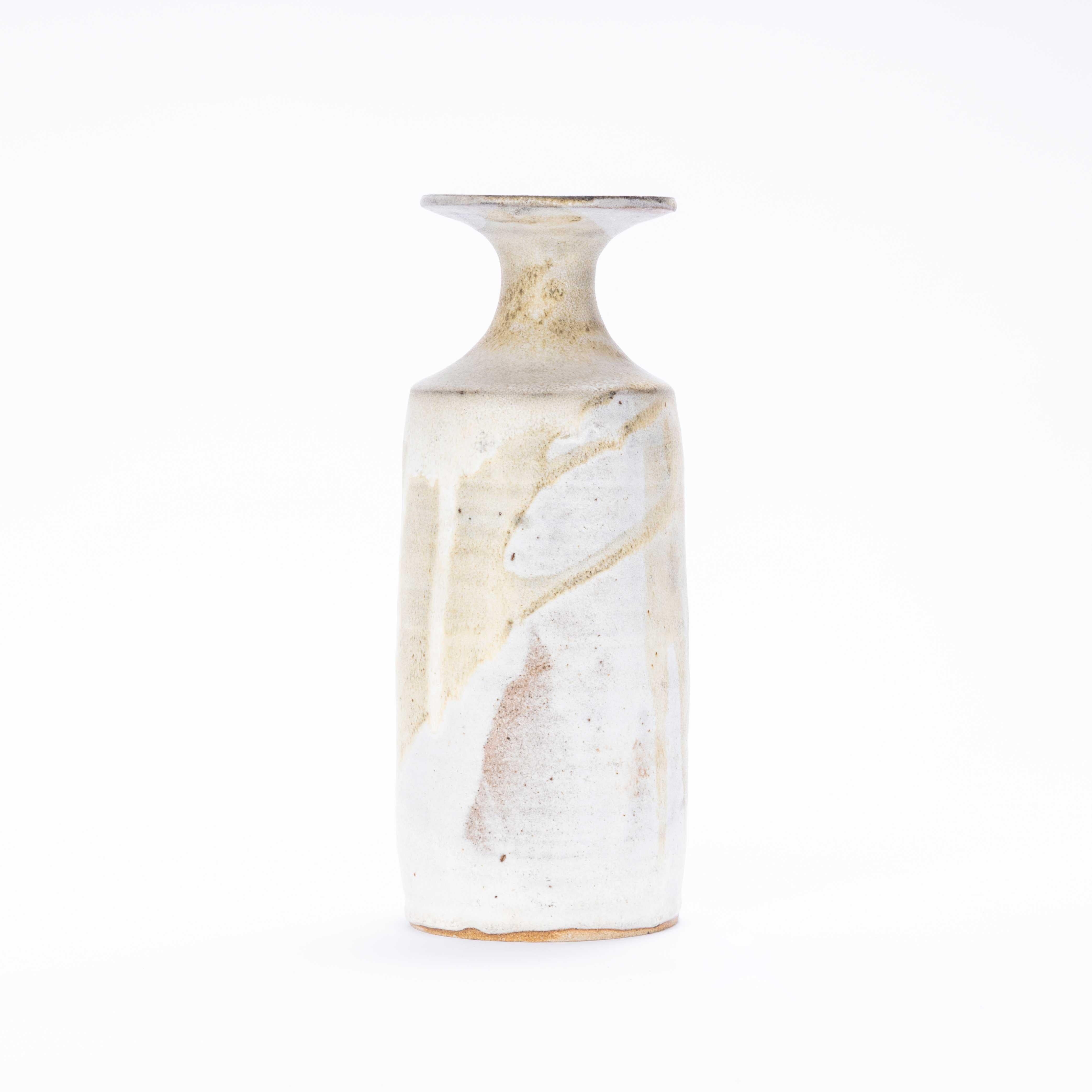 Vintage Studio Ceramics Tall Vase - Washed Glaze. 

England has a rich history of studio ceramics, often small studios for teaching or a shared space for talented ceramicists. This is a tall elegant stoneware vase with washed natural glazes. Signed