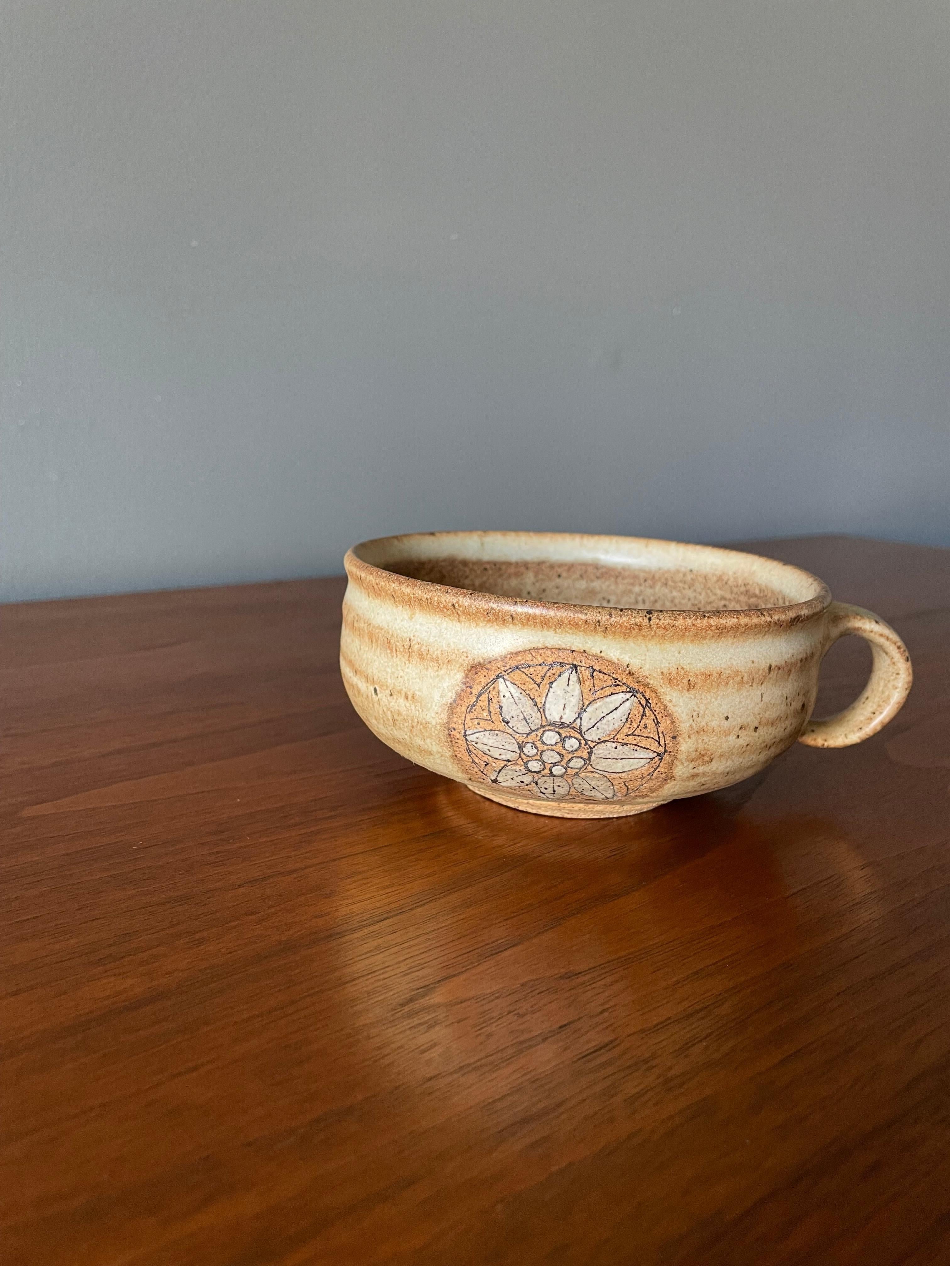 Vintage studio crafted coffee cup. Unique flower pattern and beautiful brown speckled glazing. Hand signed by the artist.