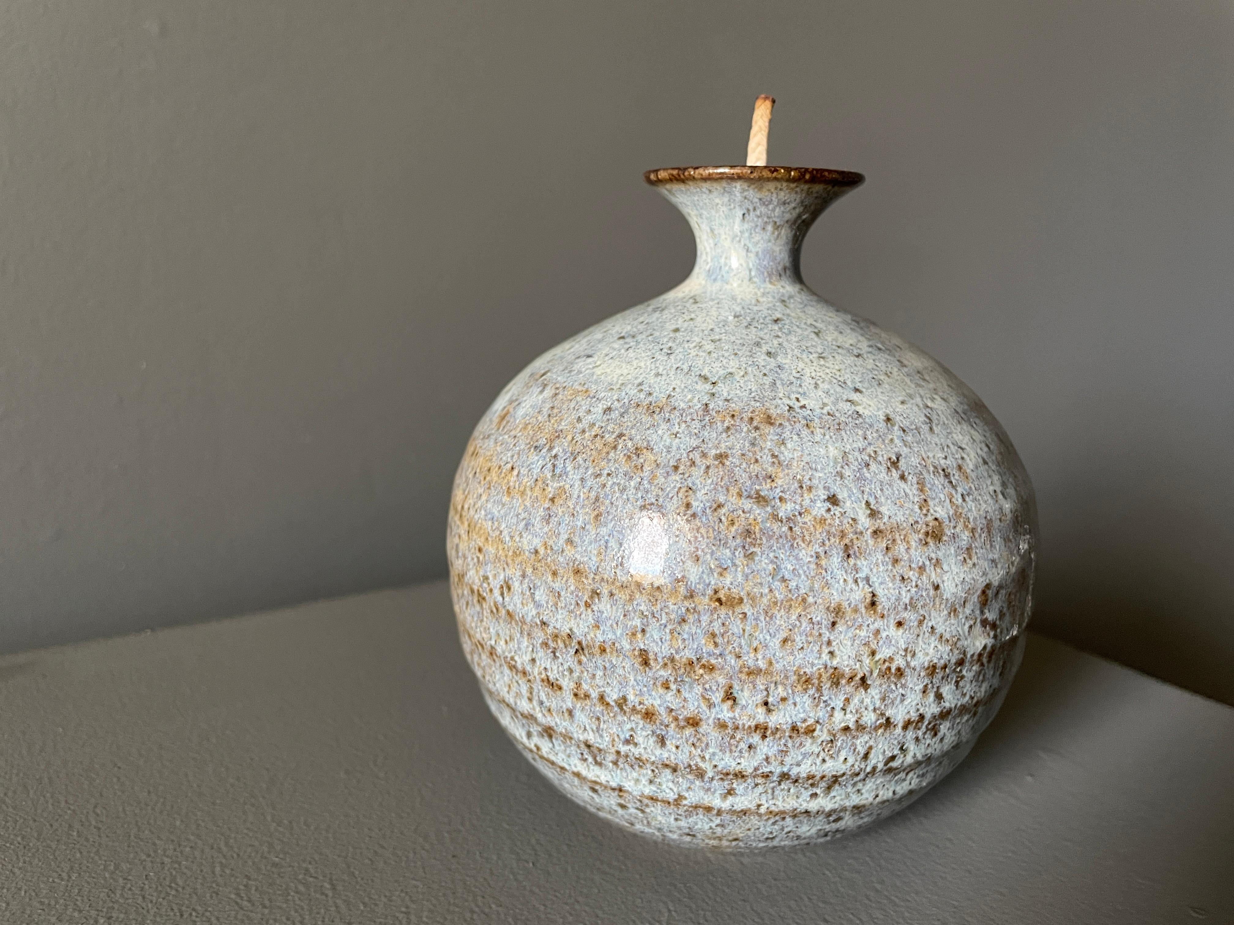 Vintage studio crafted oil lamp/ vase. Circa 1970s. Signed by the artist. Can be used as a vase or weed pot or be filled with oil and used as a lamp.