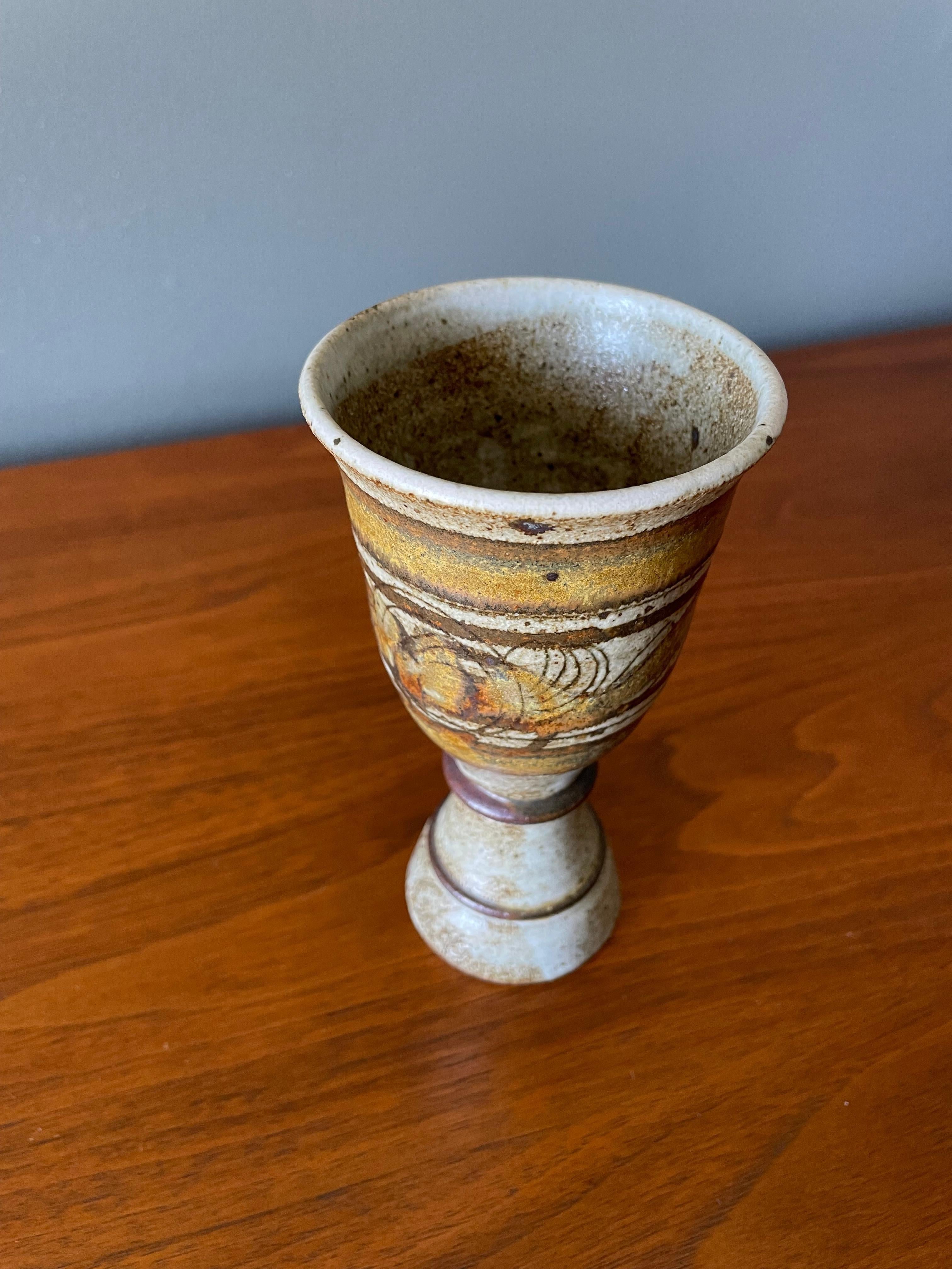Vintage studio crafted wine chalice. Hand signed by the artist. Circa 1970s. Beautiful shape and glazing pattern.
