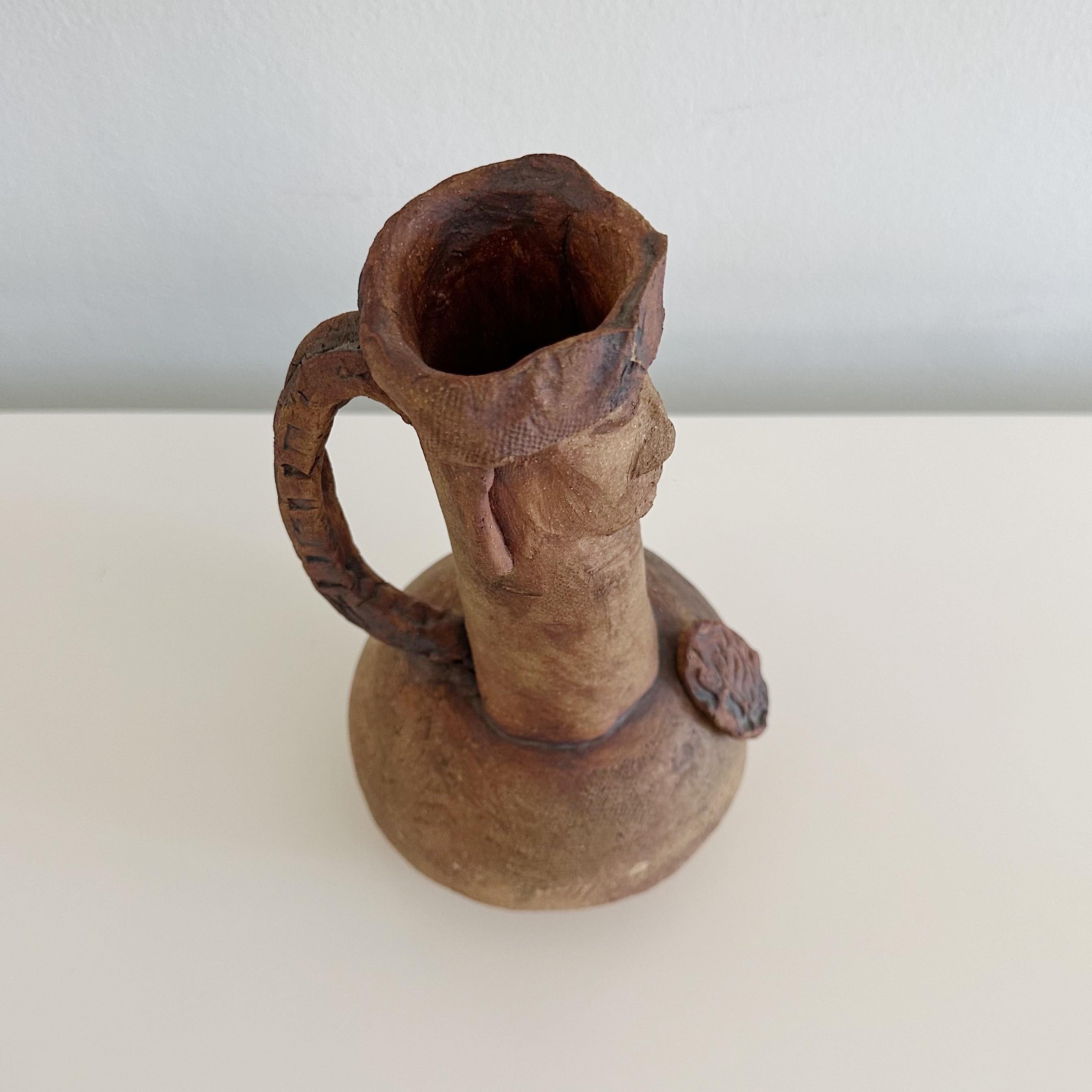 Presenting a unique studio pottery figural handled jug, pitcher or could also be used as a vase. Created by the renowned sculptor Ruth Joffa. This particular signed piece, comes with a distinguished provenance, having been acquired directly from the