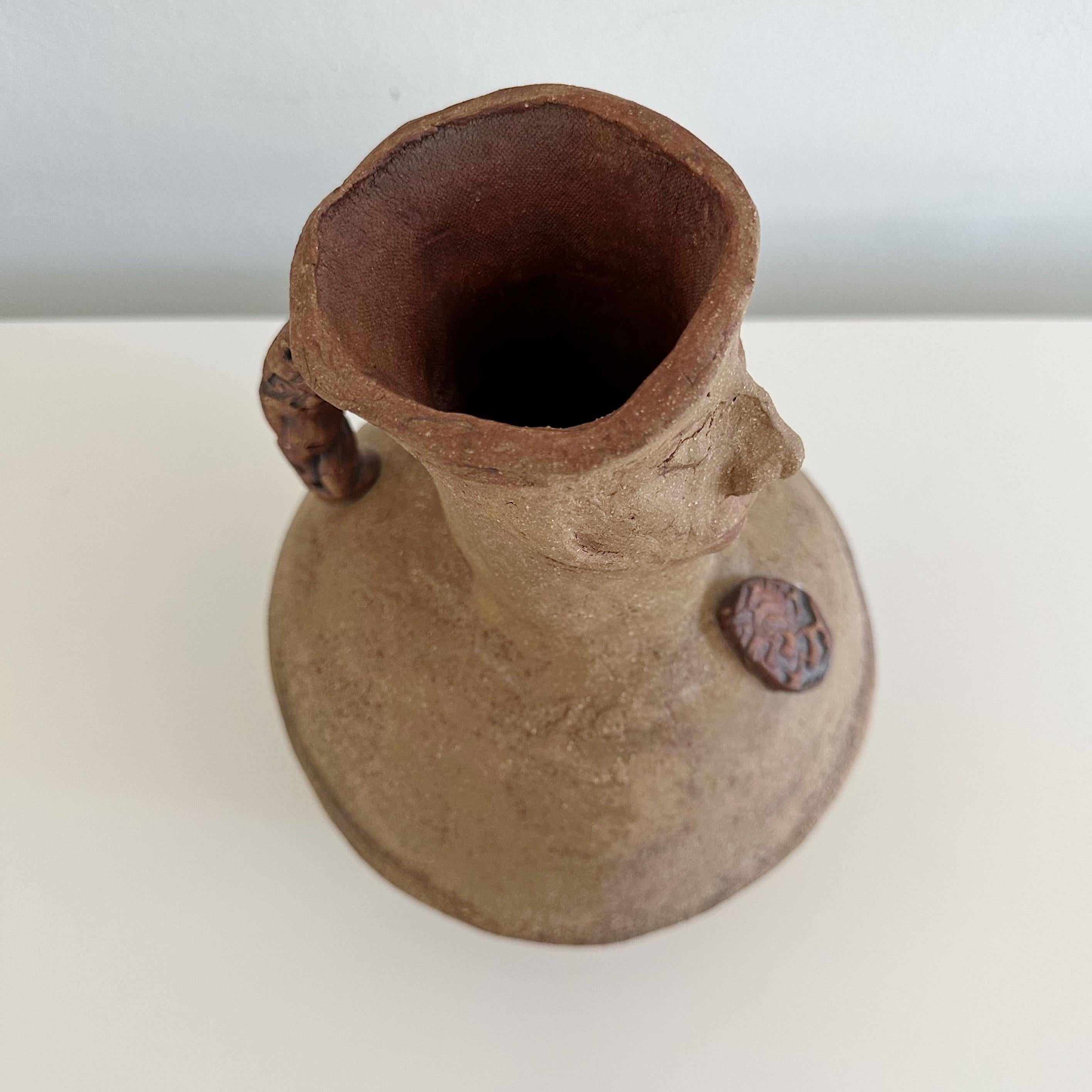 Presenting a unique studio pottery figural handled jug, pitcher or could also be used as a vase. Created by the renowned sculptor Ruth Joffa. This particular signed piece, comes with a distinguished provenance, having been acquired directly from the