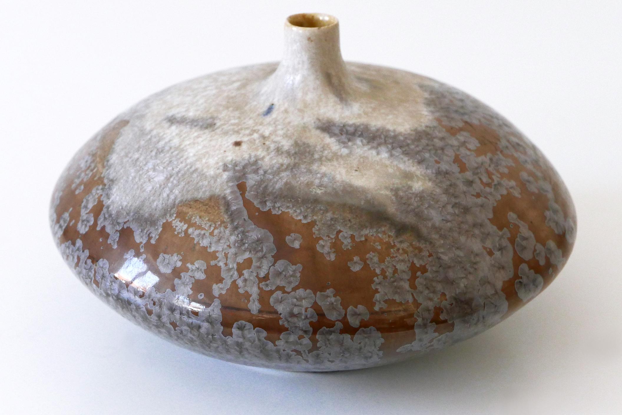 Rare, elegant and highly decorative studio pottery ceramic vase. No 05. Designed and made by famous German  studio ceramic artist Ilse Ludwig-Korbel, Tittmoning, Germany, 1980s. Artist's sign at the bottom.

We have a total of 10 ceramic vase models