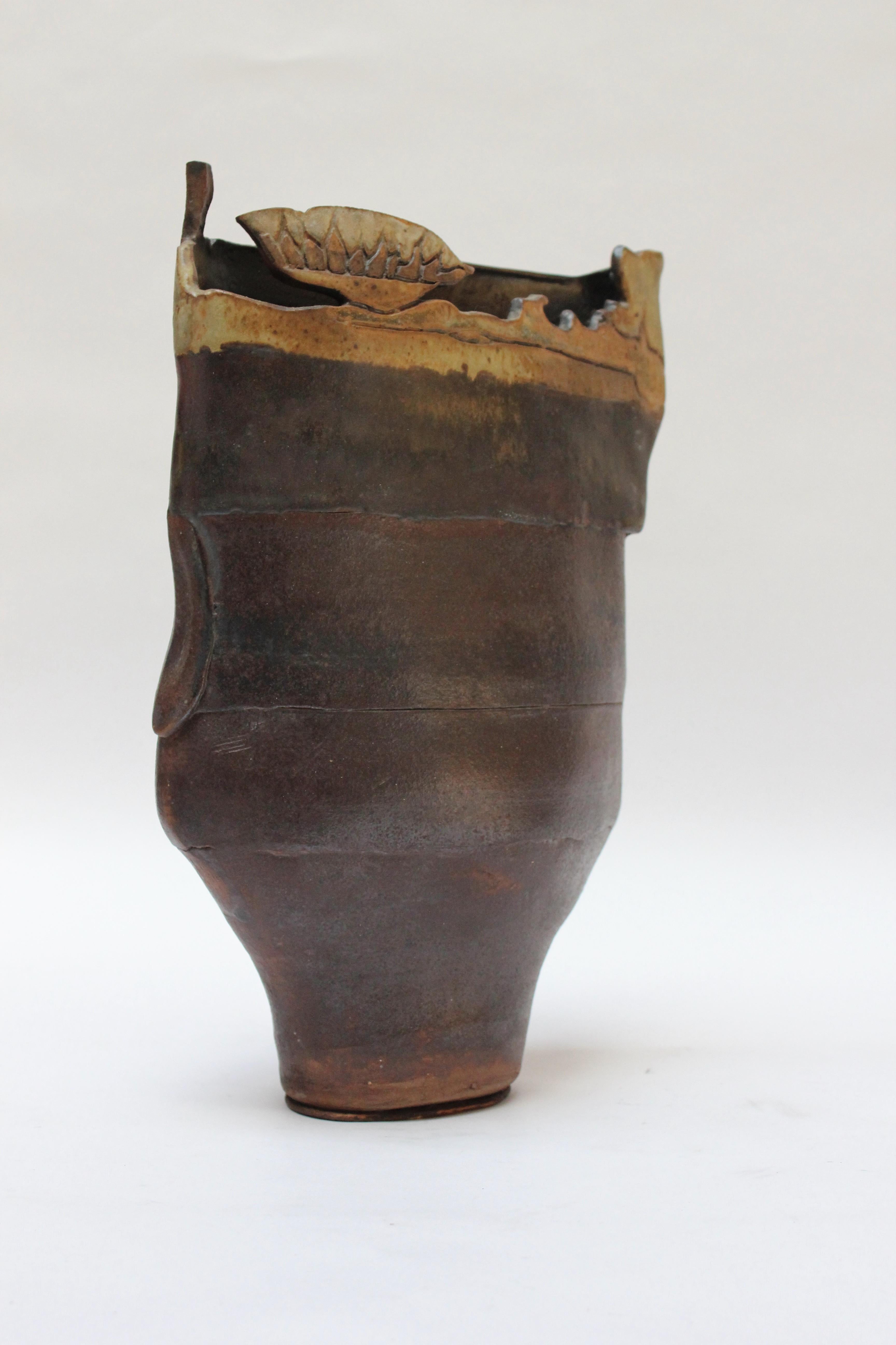 Studio stoneware vase in deep burgundy with ochre applied details (ca. 1970s, USA). Interesting textural and geometric elements. Attributed to the ceramicist, Pollack, based on provenance and attributes (we have signed examples from the same