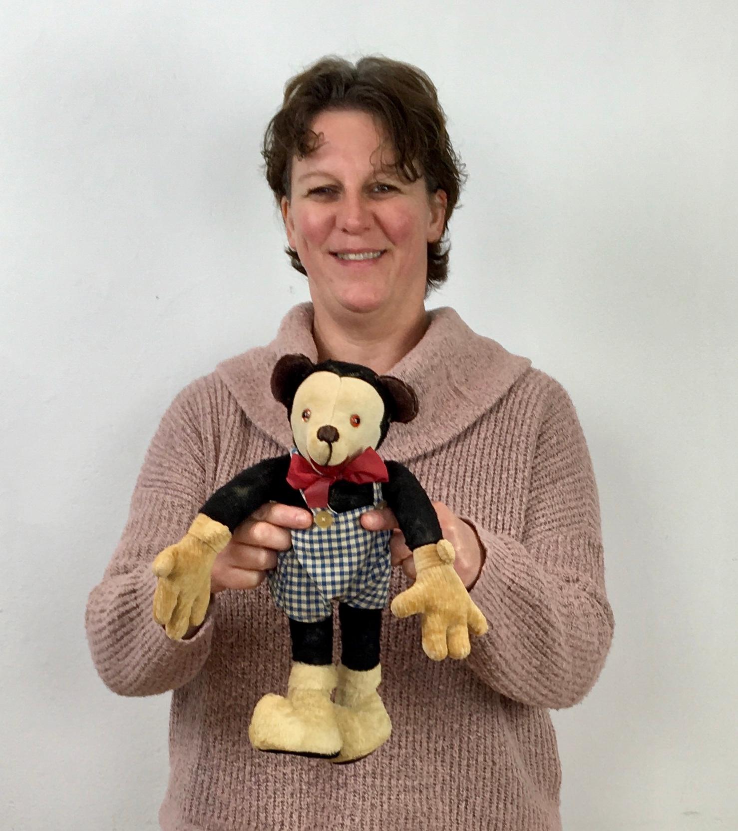 Vintage stuffed Mickey Doll. 
A Mickey Mouse children's toy circa 1930 - 1940. 
This Mickey doll is stuffed with straw, has glass eyes, a teddy open mouth, body and boots, cotton face, corduroy large gloves, a red bow and a checkered pair of
