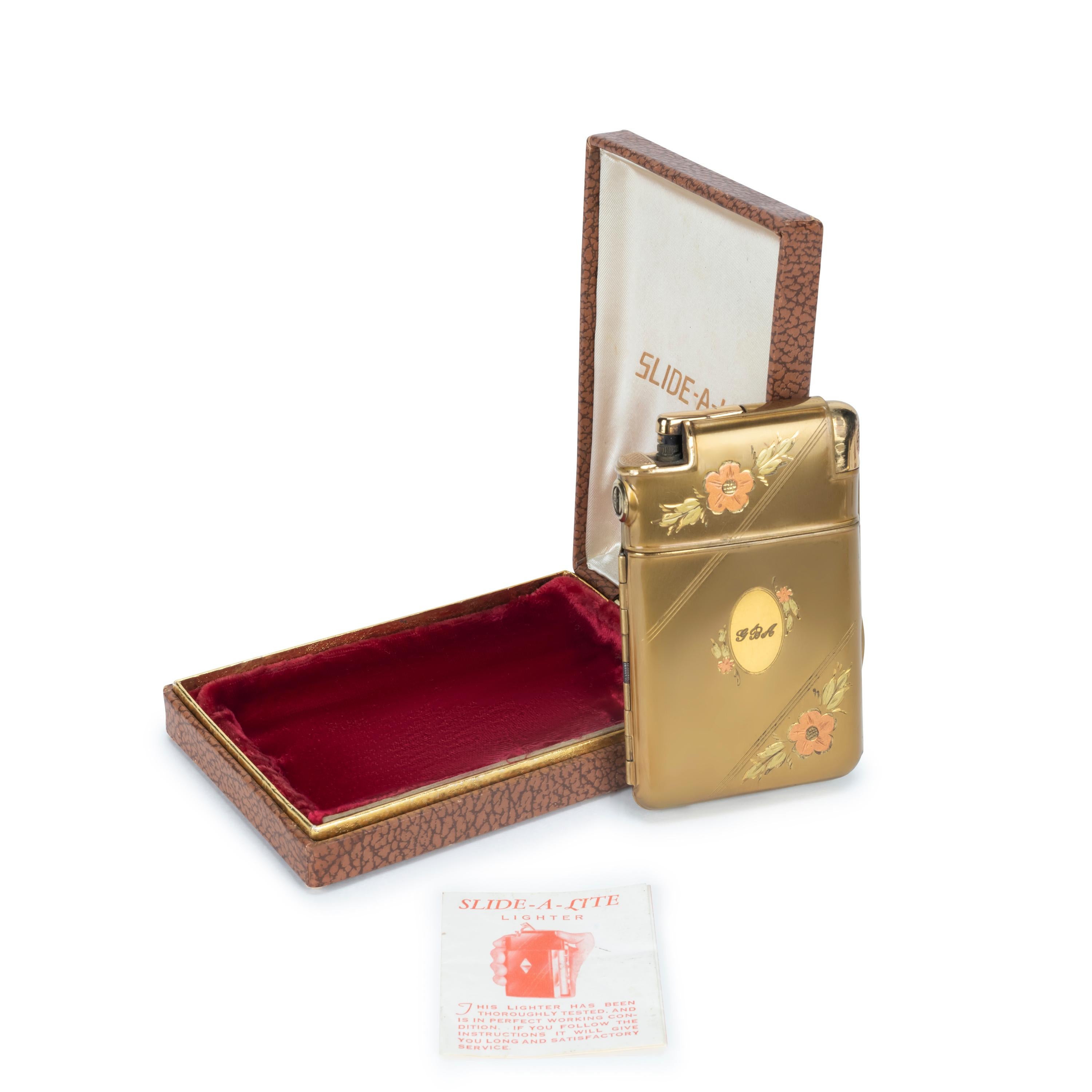 This is a stunning 1930's Art Deco Marathon gold and enamel cigarette case lighter in great working condition, and comes in the original pouch and box.
Red rich velvet interior with cream satin trimmings and chocolate lather on the outside. 
The