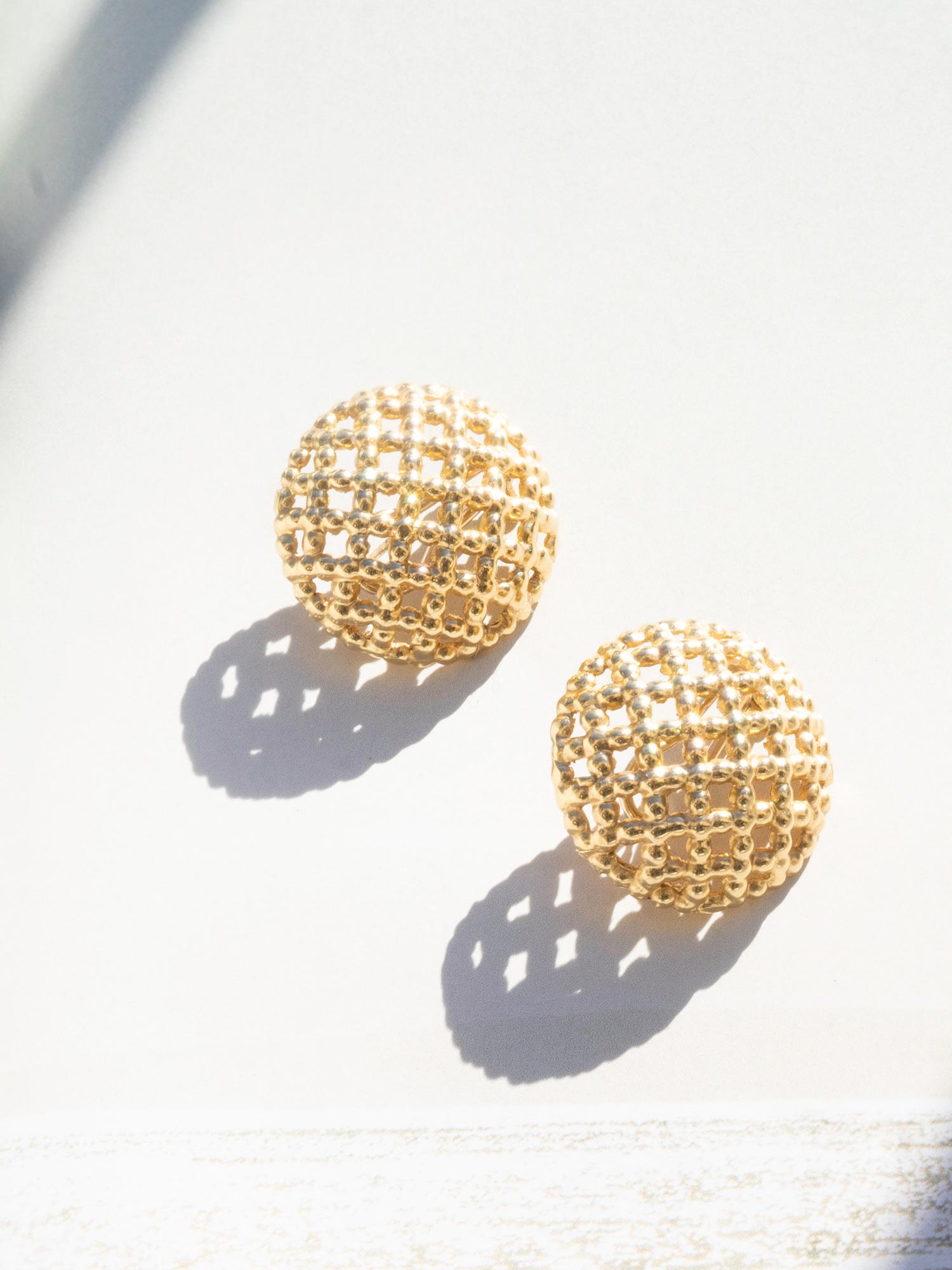  Vintage style 14 karat yellow gold button earrings with lever backs and posts. These round lightweight studs have a coral like texture that makes them truly unique and give them a summery feel. 
• 14 karat yellow gold
• Size: 25mm round 
• Design: