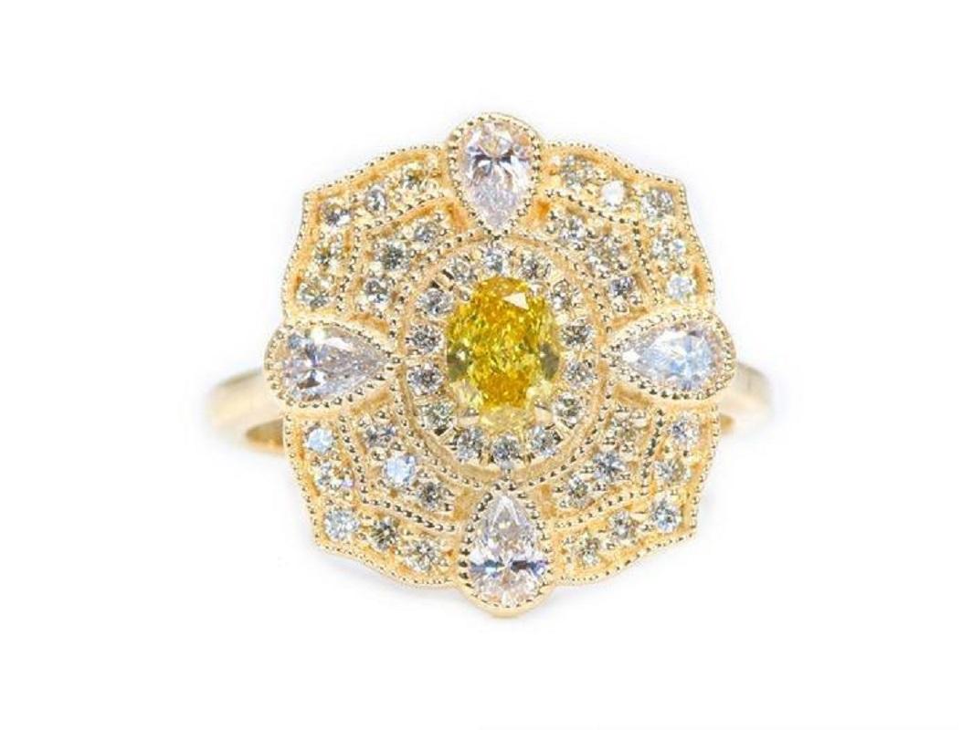 One-of-a-kind vintage style ring with a rare and Beautiful orange-yellow diamond with a 0.32-carat weight and extra 4 pear shape natural diamonds with an FVS quality with 0.30 carat of round brilliant diamonds made from 18k yellow gold with GIA