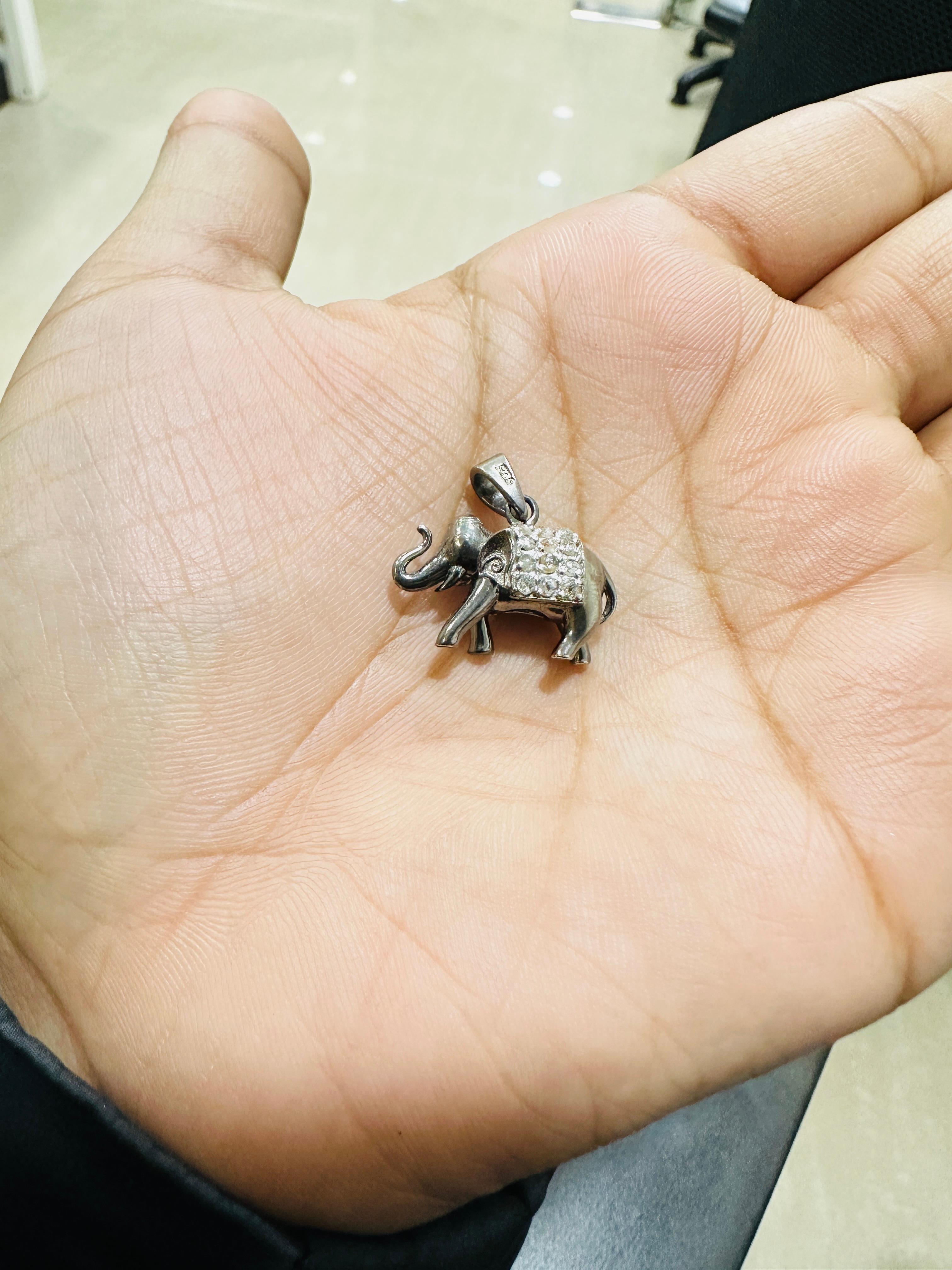 Lucky Elephant Unisex Pendant with Diamond Embellishments in sterling silver studded in silver. This stunning piece of jewelry instantly elevates a casual look or dressy outfit. 
April birthstone diamond brings love, fame, success and