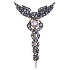 Spilla Caduceo in stile vintage in oro e argento 9kt con perle e diamanti