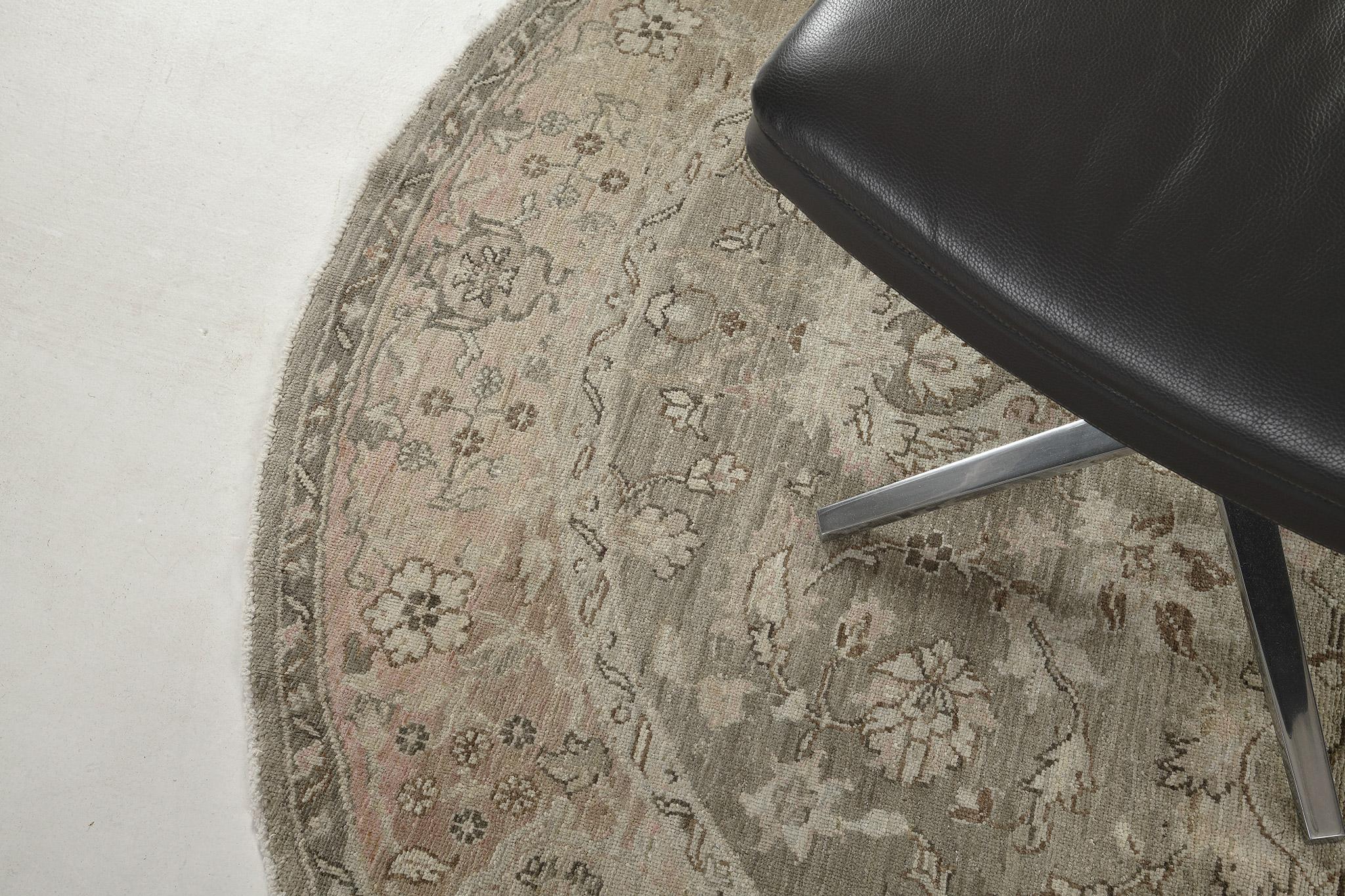 Get intrigued by this Agra Rug that features a floral design that complements the lush scheme. Series of symmetrically leafy scrolls, tendrils, and blooming elements are featured in a round-shaped rug. Perfect for your home interior that matches