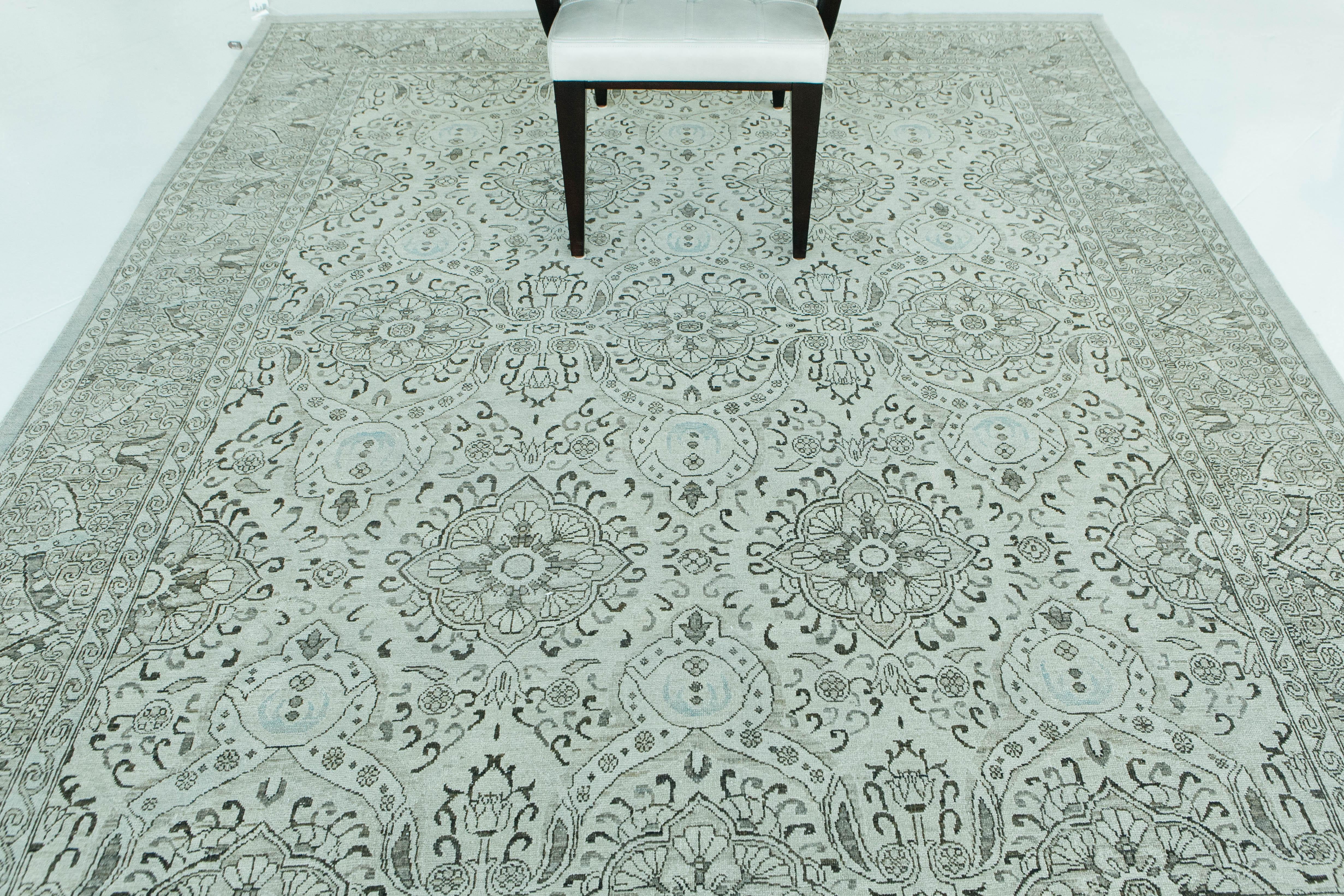 A gorgeous Agra style recreation with beautiful vintage tones in peach, taupe, and light blue. This rug's intricate Agra style motifs and spiraling vines in addition to its complementary colors give this Agra rug a light, ethereal appearance. This