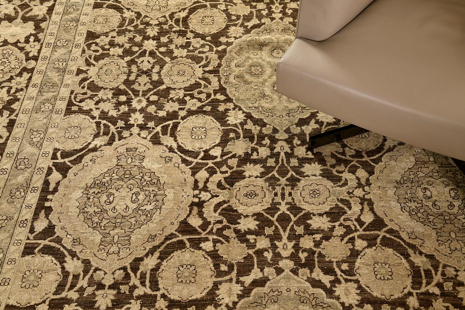 This is stylish hand-spun wool of Amritsar using brilliant patterns. Fashionable florid designs and leafy scrolls are harmoniously contributed to the surrounded symmetrical florets and vines. While the rug dominants a warm wood field, a light tan
