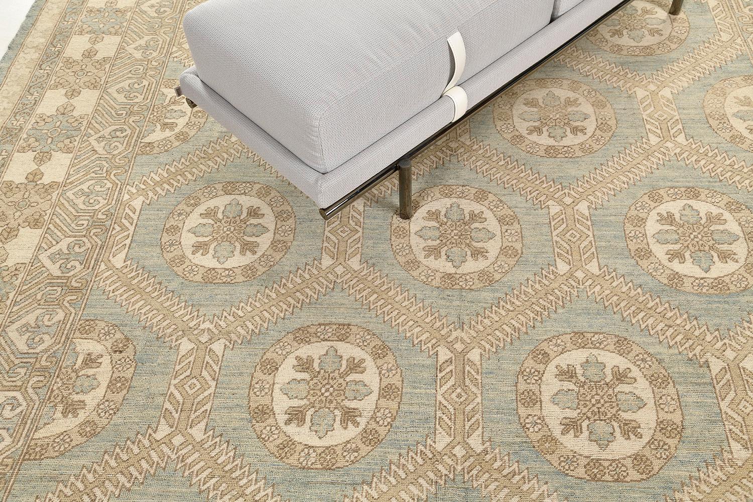 An astounding revival of Arts and Craft style rug that features the elegant tones of the earth. Fabricating gracefully in an ocean field, the geometrical pattern and ornamental embellishments are formed flawlessly enclosed by a classy border of