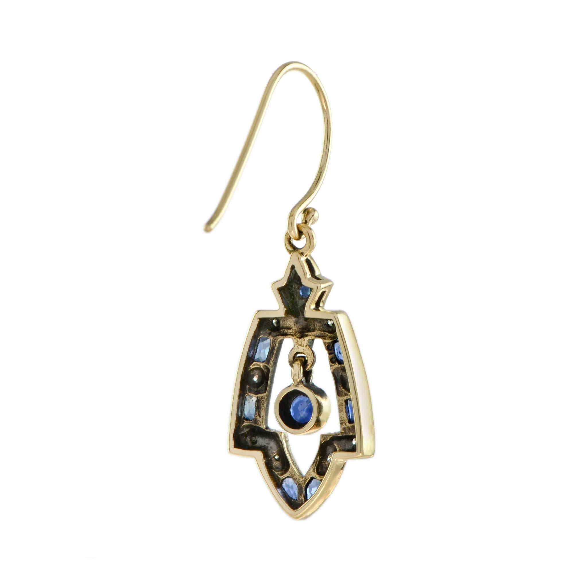 Suspending two round shaped natural blue sapphire, accented by sapphires and diamond openwork frames. These unique earrings make the perfect accessory to dress up your ears.
Earrings Information
Style: Vintage
Metal: 9K Oxidized Yellow Gold
Width: