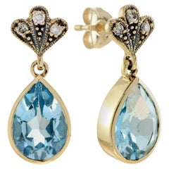 Boucles d'oreilles en goutte de style vintage en or jaune 9 carats avec topaze bleue et diamants