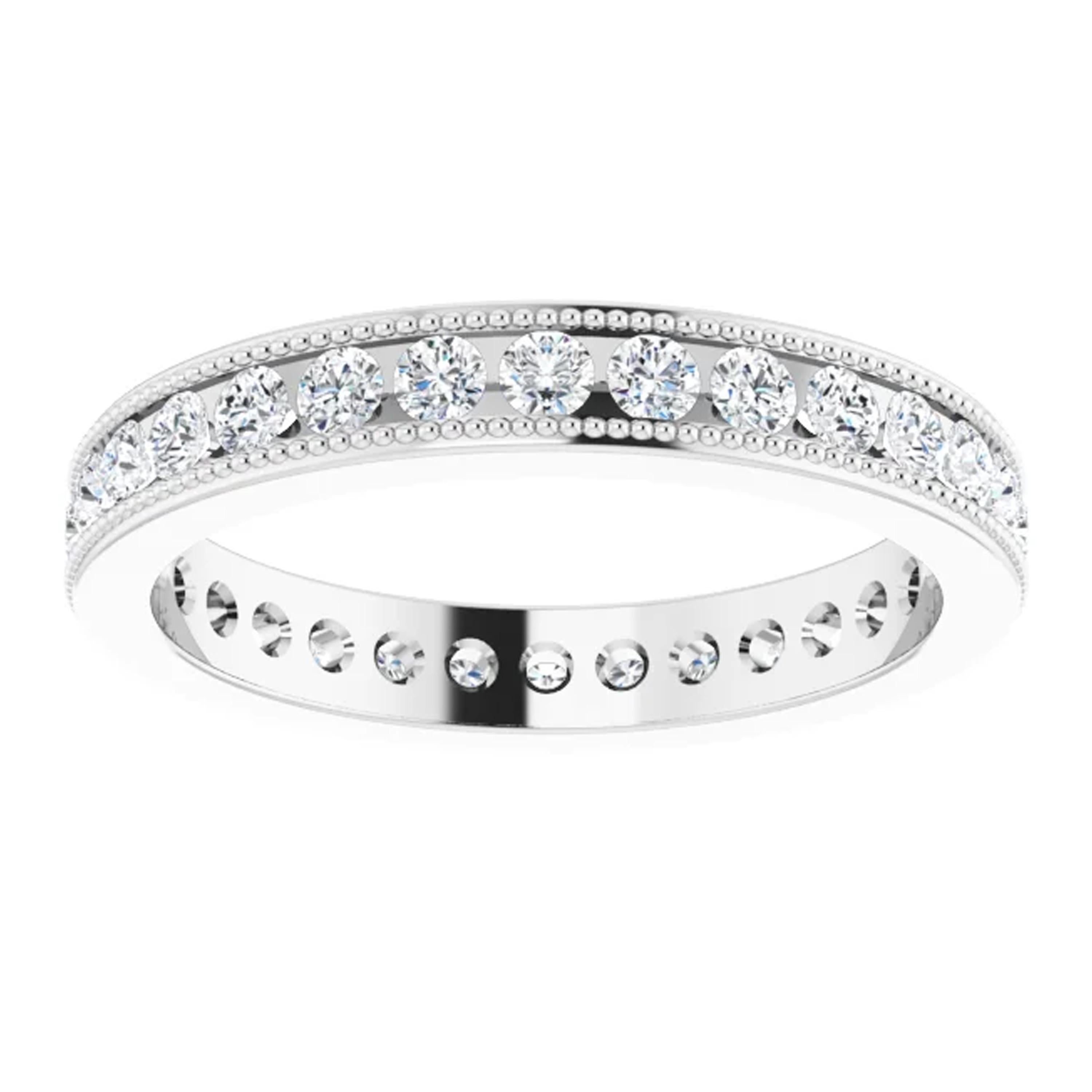 Inspired by the Victorian era, this vintage style eternity band is decorated with intricate milgrain detailing along the edges. Full of fire natural diamonds are set closely together with exposed sides and an open back design. This type of channel