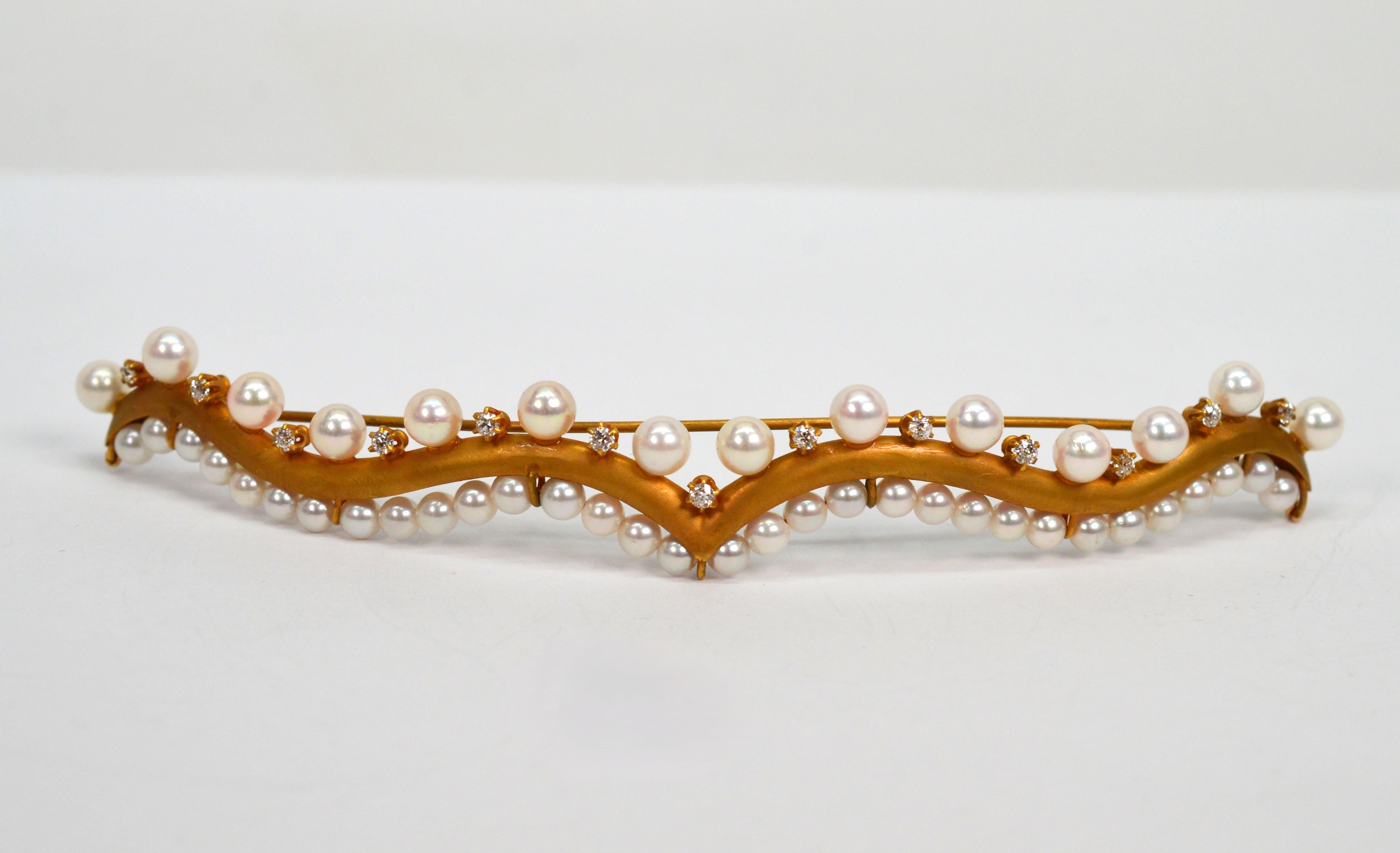 Satin 14 kart yellow gold and lustrous pearls with diamond accents create this glamourous and unique hair ornament. Perfect barrette for a fancy bridal updo or to add a defining detail for a special occasion. Contoured to be easily integrated into