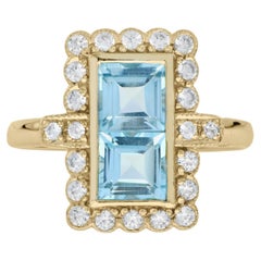 Anello con doppio topazio blu e diamanti a raggiera in stile vintage in oro giallo 14 carati