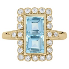 Bague de style vintage en or jaune 14 carats avec double topaze bleue et halo de diamants