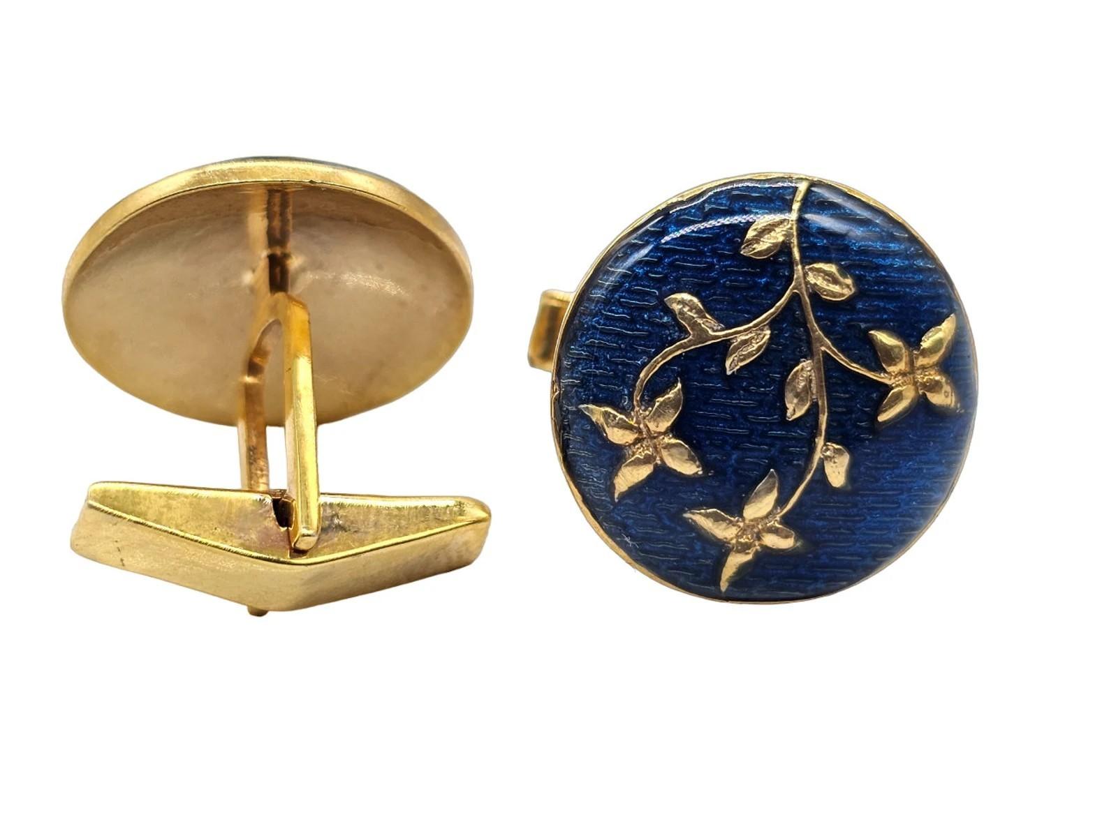 Cast from sterling silver, these cuff links are hand set with blue enamel and gold floral pattern.

FOLLOW  MEGHNA JEWELS storefront to view the latest collection & exclusive pieces.  Meghna Jewels is proudly rated as a Top Seller on 1stdibs with 5