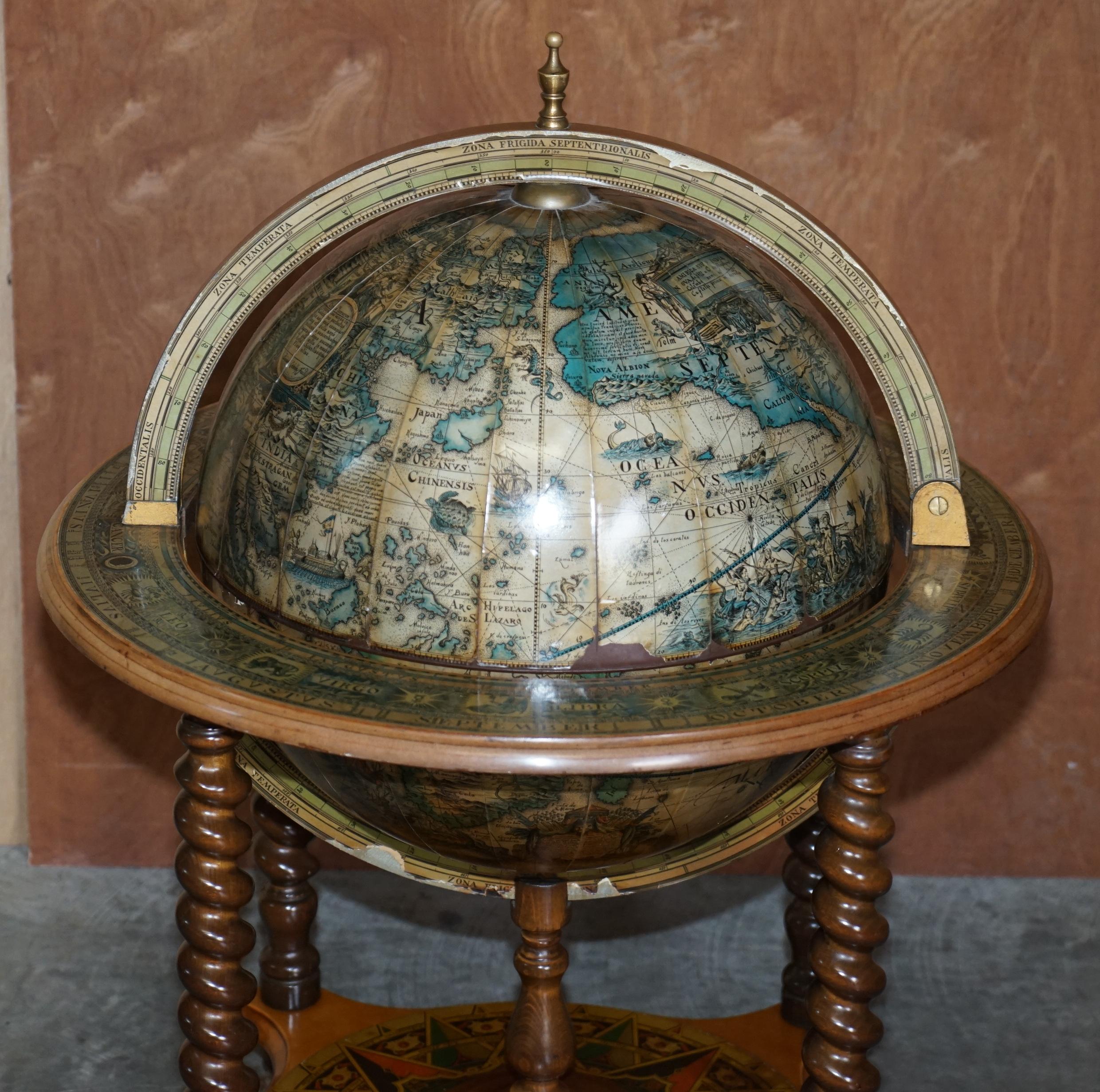 We are delighted to offer for sale this nice decorative vintage floor standing globe drinks cabinet table with 19.5 inch globe

A good looking, well made and decorative piece, the top opens up to reveal a drinks cabinet with original ice bucket
