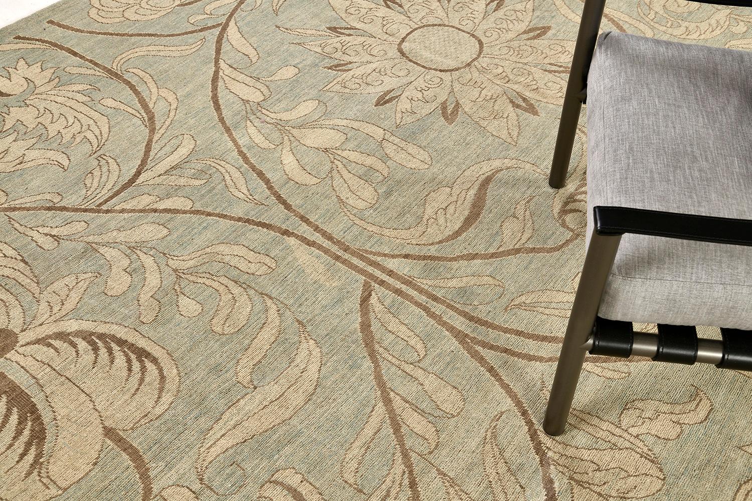 A dreamy vintage style floral design rug that showcases the graceful detailing of its botanical composition all over the dusty blue field. Featuring the golden stem accents that makes the rug unique and regal on its own way. A magnificent rug that
