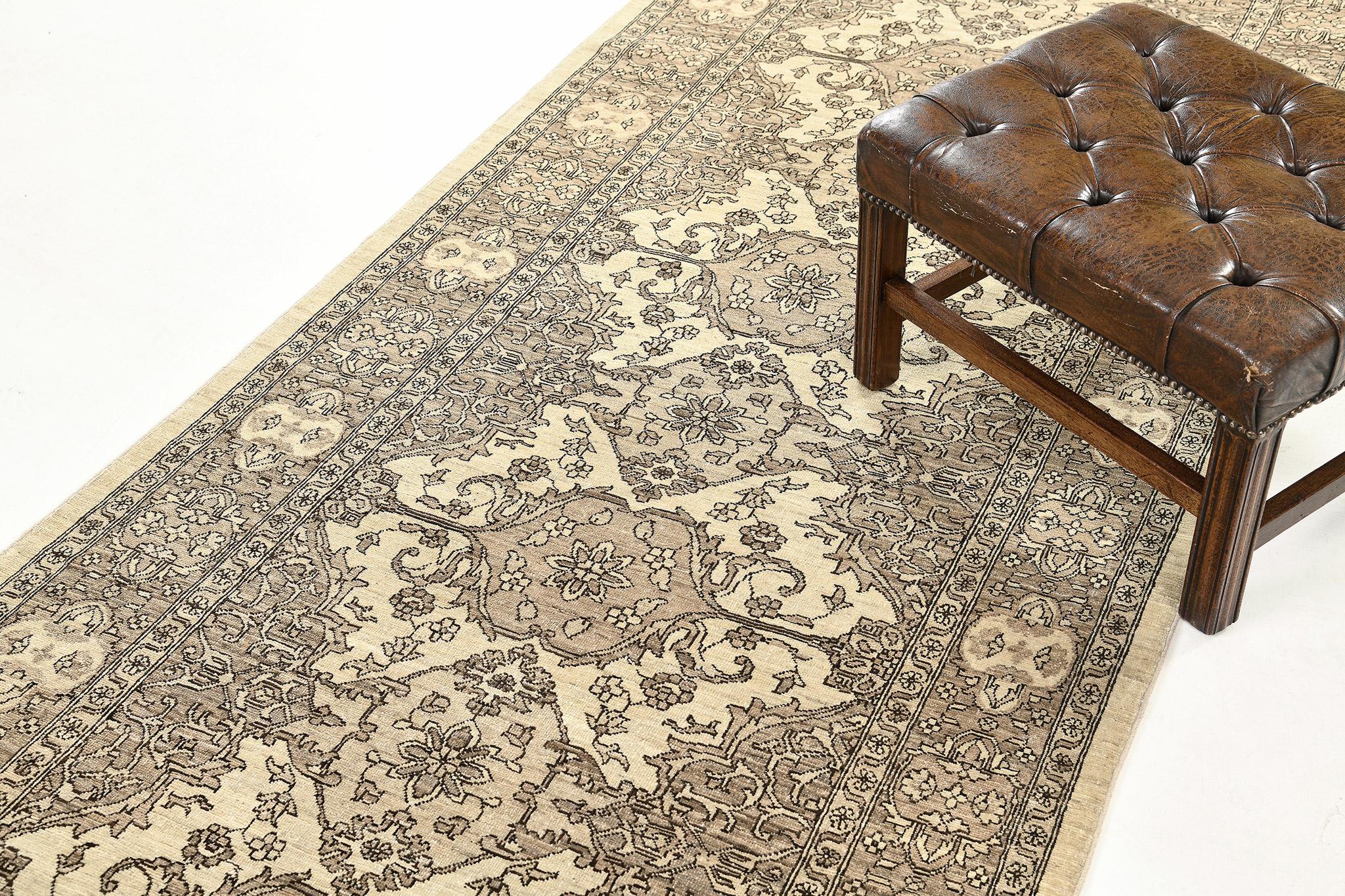 This extraordinary revival of Tabriz runner has an intricate mirrored pattern of the symmetrical elegant floral scroll and a controlled ambiance of neutral tones with symmetrical motifs of borderlines.  This masterwork of art utilizes brilliant