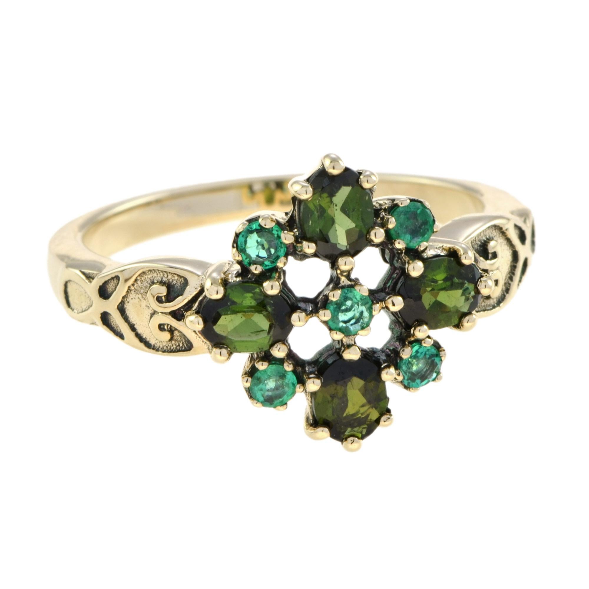 Vintage green tourmaline and emerald ring is a classic design that would be a wonderful addition to your fine jewelry collection. A perfect piece to wear all year long, and the floral motif would be wonderful this season with a beautiful spring or