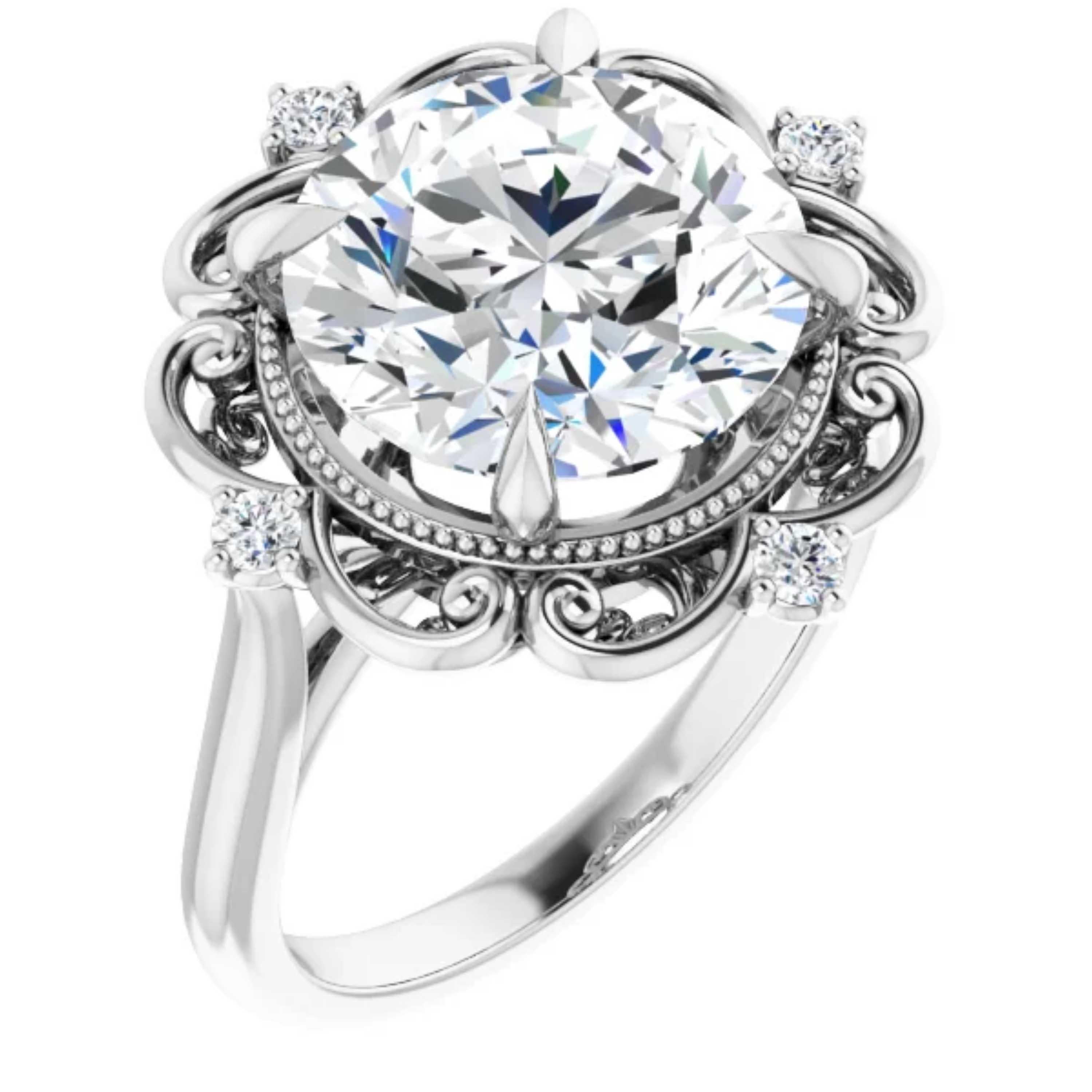 Inspired by the Victorian era, this vintage style engagement ring is decorated with intricate milgrain beads. Beautiful filigrees adorn the gallery and the center diamond. Featuring a GIA certified natural round brilliant diamond in the center, this