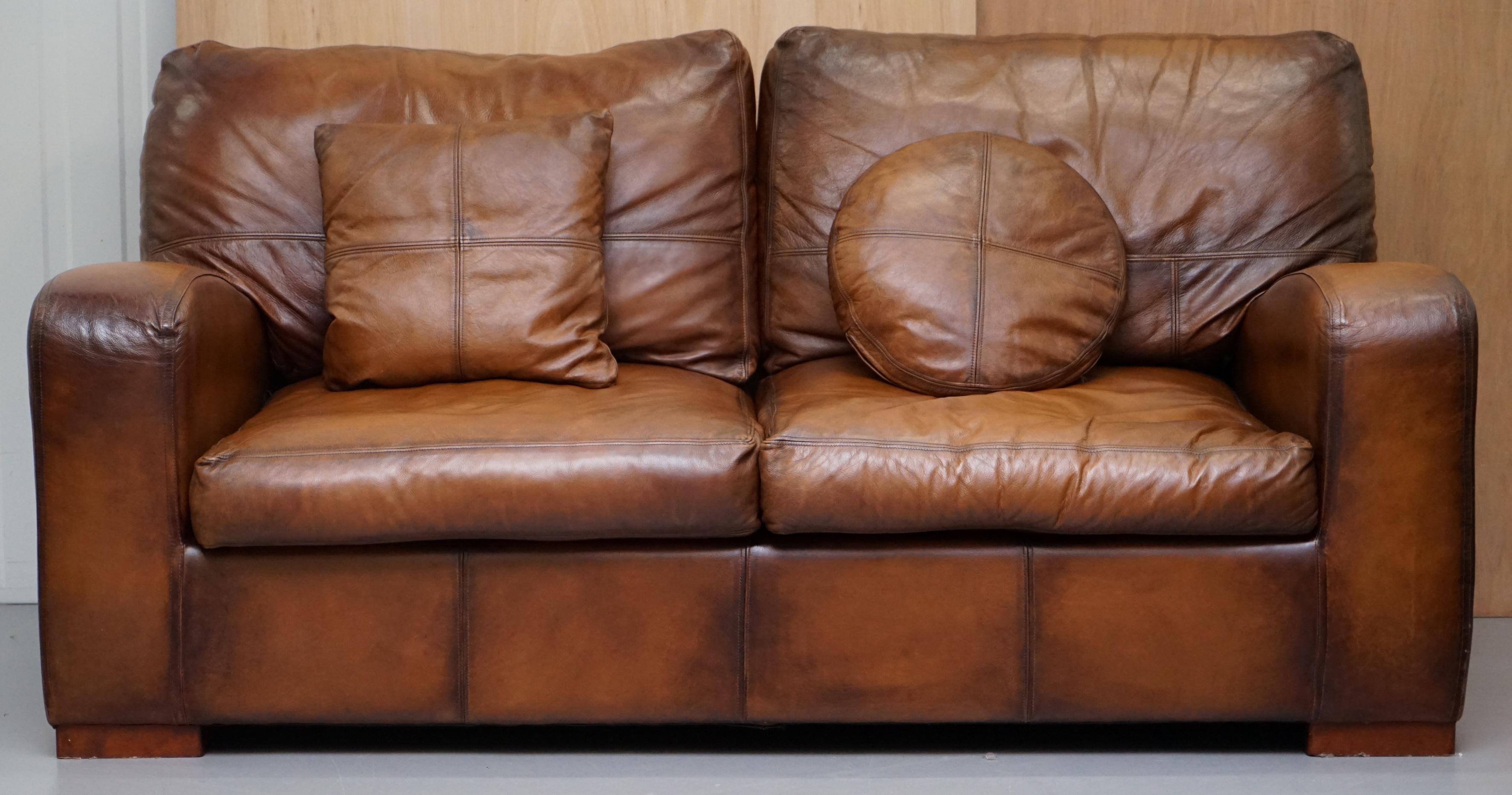 We are delighted to offer for sale hand dyed aged brown leather sofa

A good looking well made and decorative sofa, the lines to the sides especially the arms are very nice

We have cleaned waxed and polished it, its in pretty much retail new