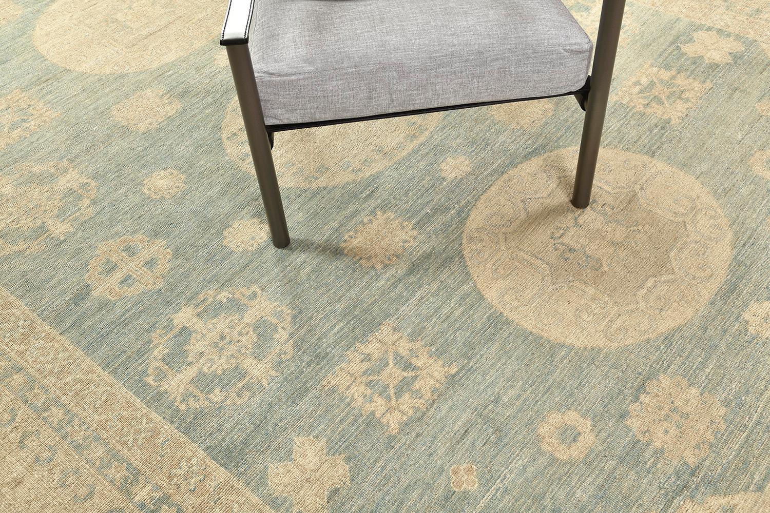 Let this be yours forever with this inviting rug. Faded hues of sage and blues are completing the enchantment of this masterwork. Three vast medallions surrounded by scattered motifs and elements add to the charm. This decor is rich in geometrical