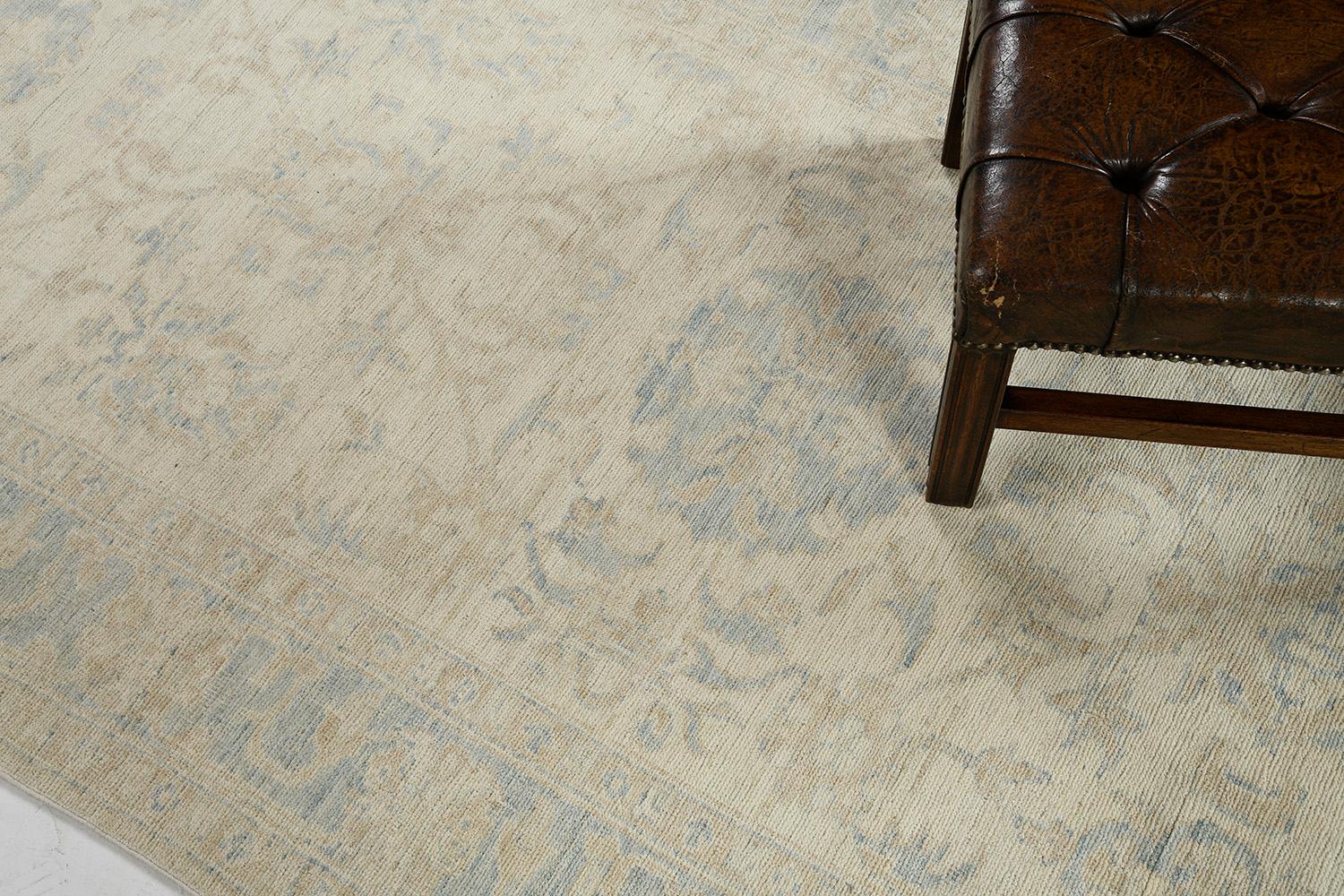 An impressive pile-woven wool Khotan design from our collection has come and flexed its versatility.  Three grandiose medallions and connecting motifs in the ash gray and sky theme dominate the entire pattern of the rug. Beautiful floral bands are