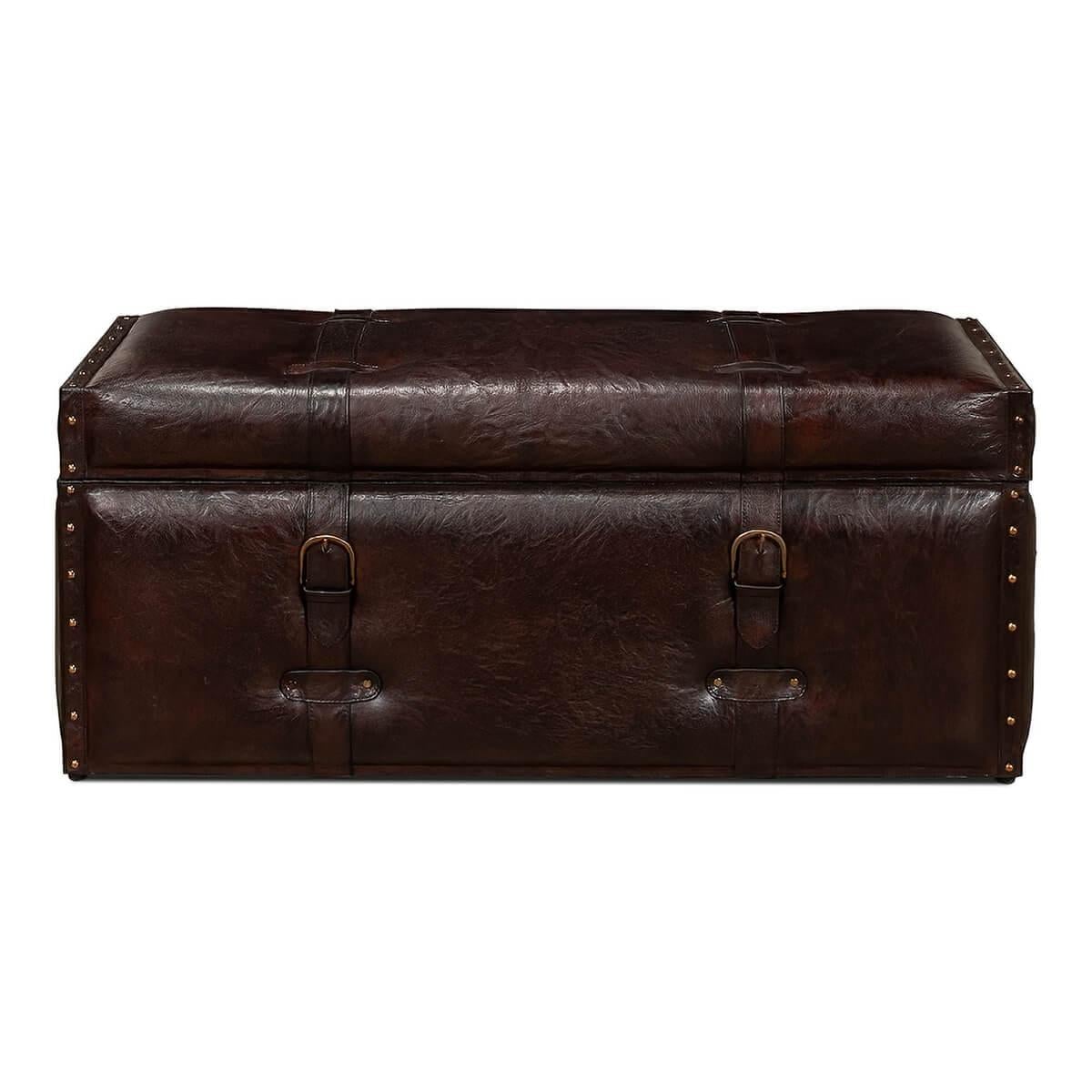 A vintage-style leather trunk bench with nailhead trim. The perfect addition to any room, this piece can be used for seating and storage. 

This piece is designed to have the look and feel of a vintage-style leather travel trunk and has design