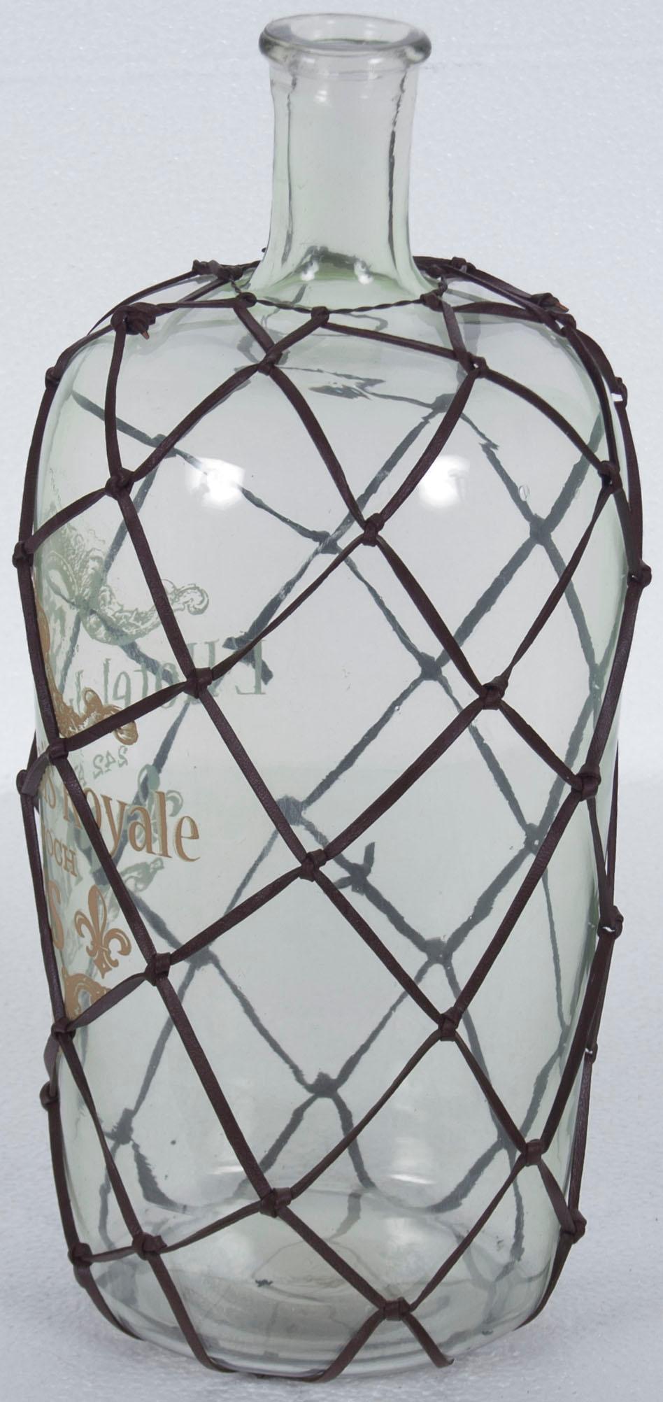 This unique leather wrapped decorative bottle is an all season decoration for the home. Its fairly large size makes it ideal for a variety of decorating ideas that are only limited by your imagination! A knotted leather cord mesh surrounds the glass