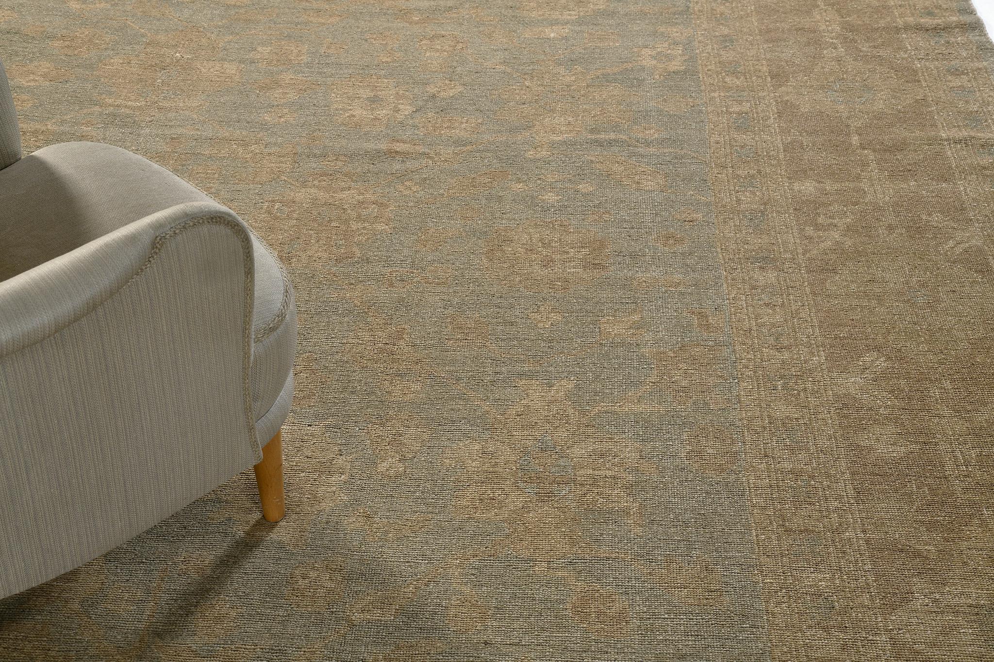 A truly wonderful Oriental rug that features these stunning muted colors of sand, camel and dusty blue. Gently cascading elements of flower clusters, leafy tendrils and well-defined leaves, create a magnificent all-over pattern of this work of art.