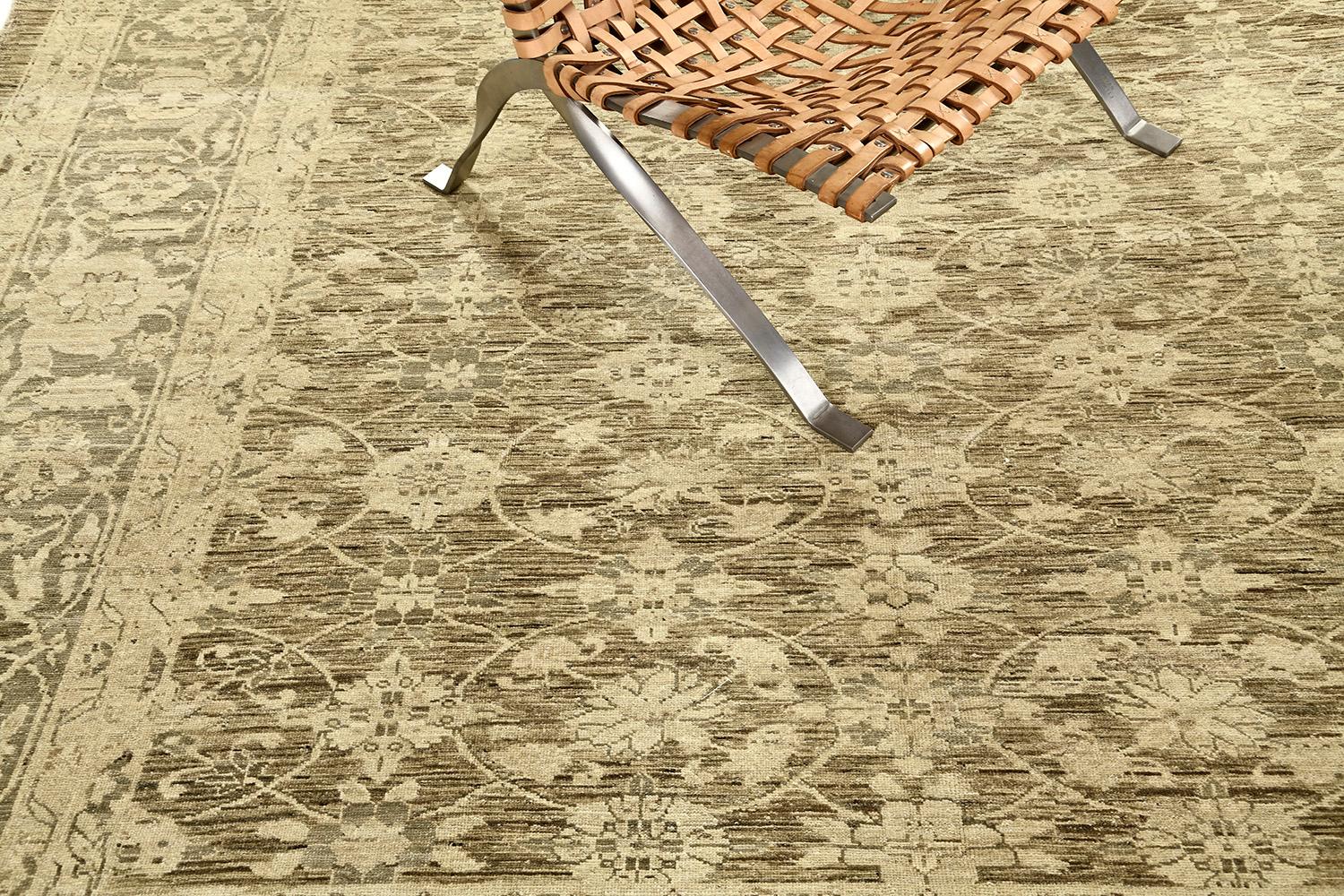An exquisite revival of Vintage style Mahal rug that evidently shows the intricate details of the allover pattern dancing along the sandy field featuring the warm tones of brown, gray and gold. Featuring the blooming palmettes, lotus, serrated