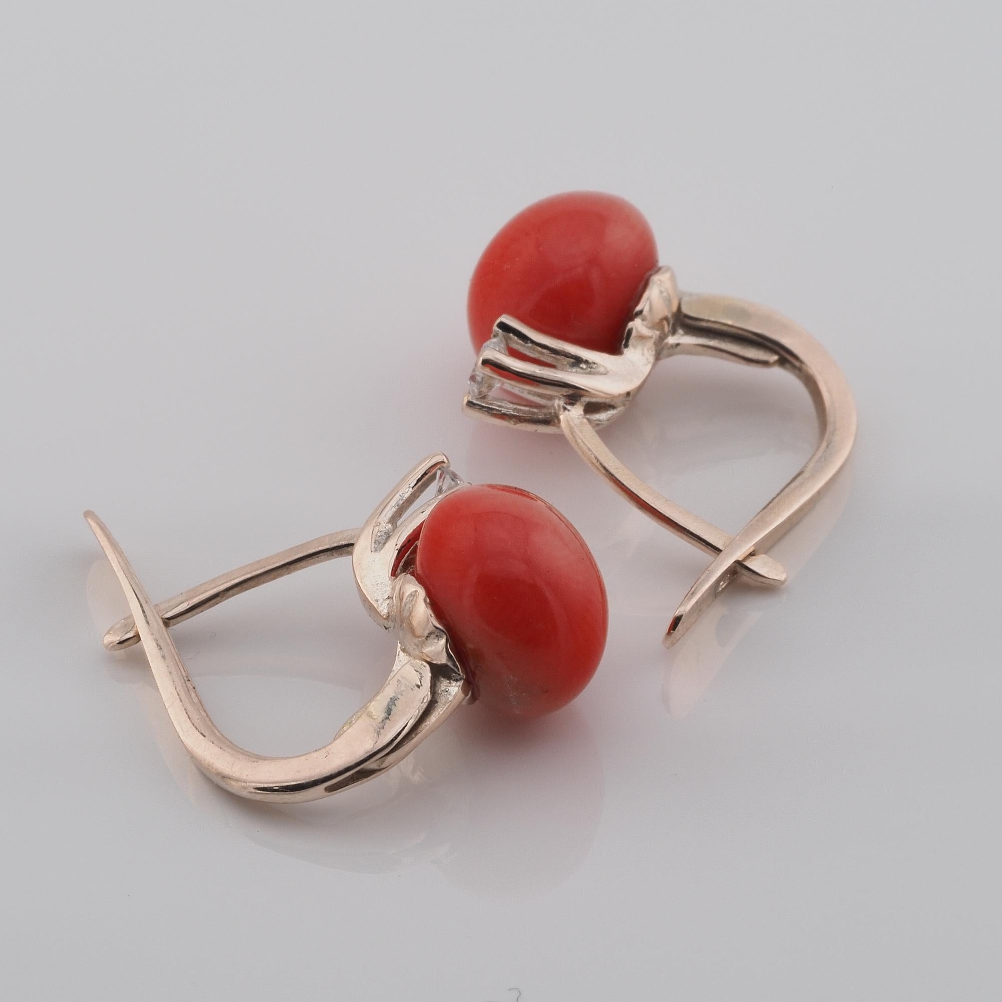 Italian Monachina Earrings

Very pretty vintage style Italian Monachina earrings, the most wanted for all occasion in the Italian tradition with a round Red Coral cabochon all natural and untreated of 8 mm. diameter, topped by a solitaire