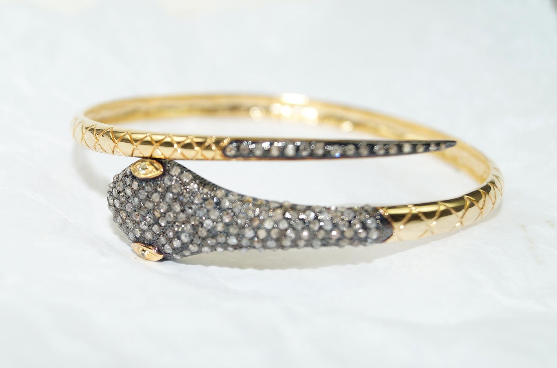 This snake gold bracelet is a versatile and captivating accessory that can add a touch of elegance, mystery, and individuality to your style. This diamond gold bracelet consists of:

Diamond- 2.88cts
Diamond type: Rose cut diamonds
Diamond color: 