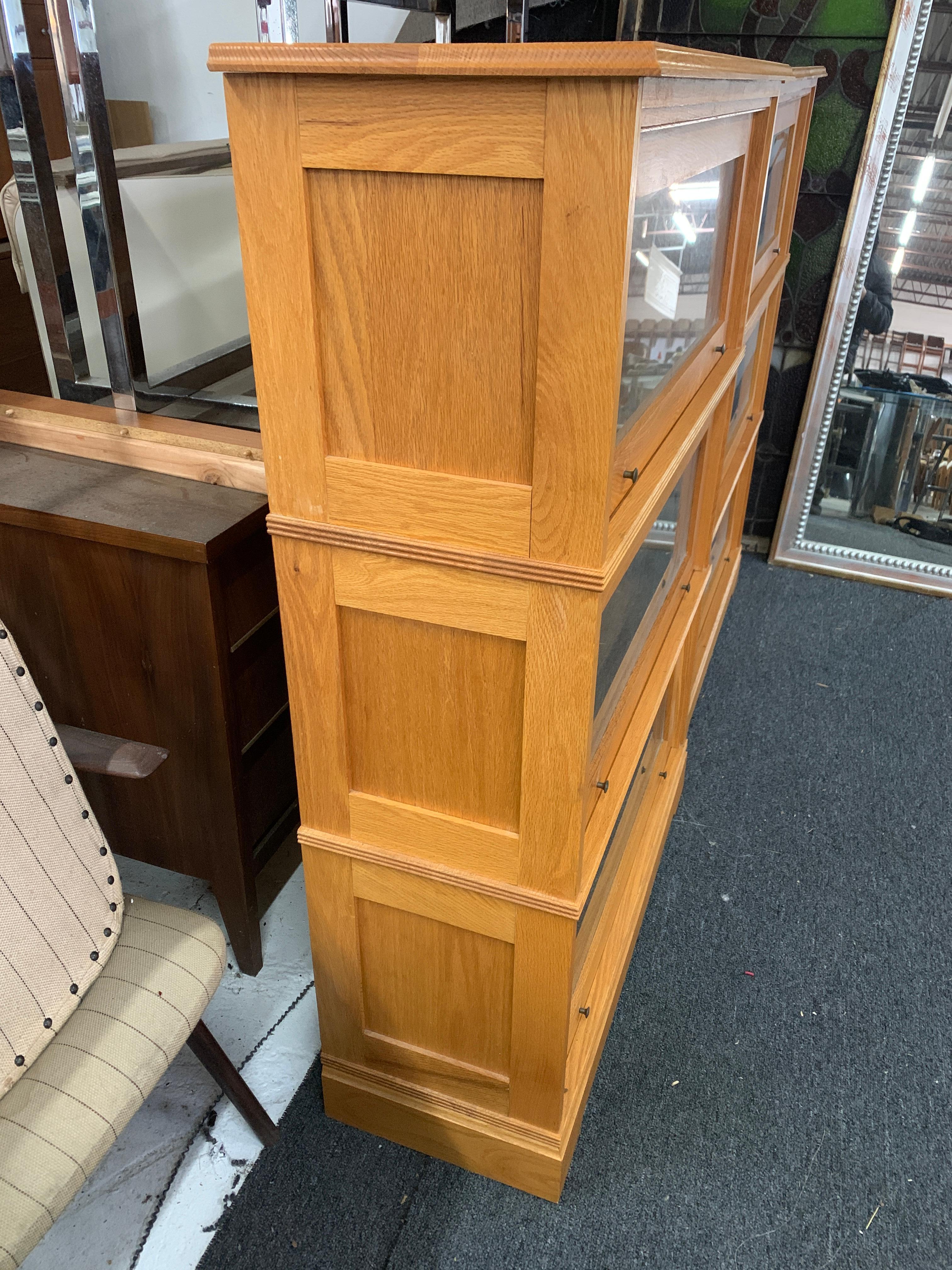 Pair (2) Solid oak barrister bookcases. Perfect for any room in need of MCM style book storage. 