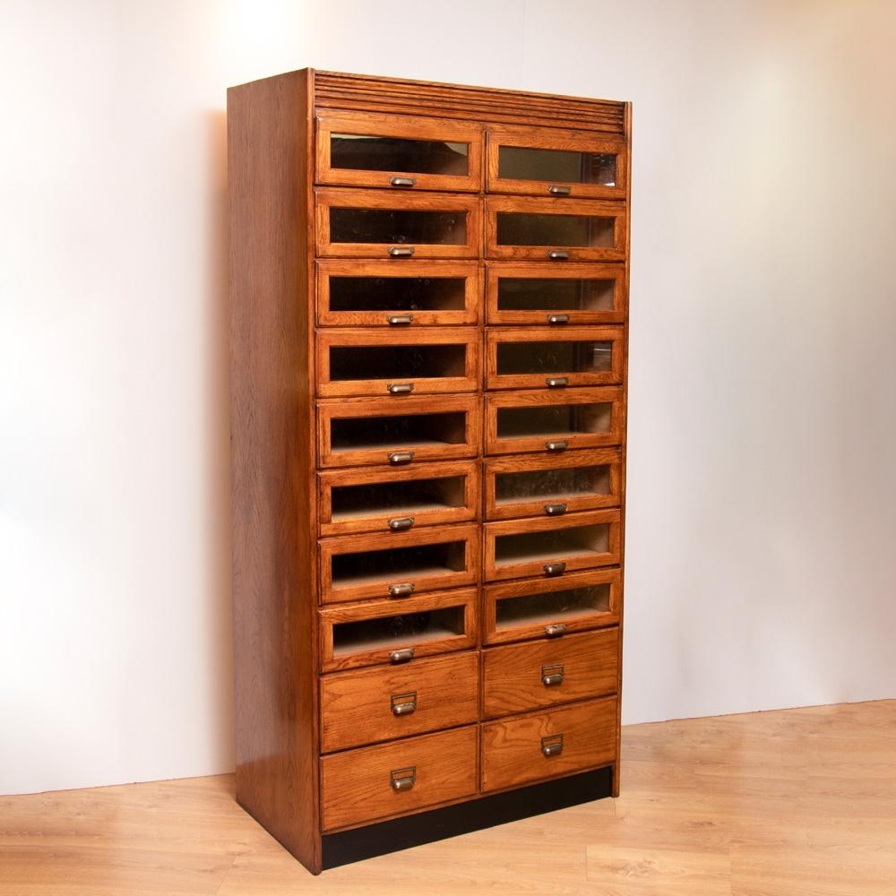 A vintage style oak haberdashers.
Enormously stylish and practical bank of 20 drawers which can swallow all that mess and clutter we don't want anyone else to see-and yet do it elegantly.
