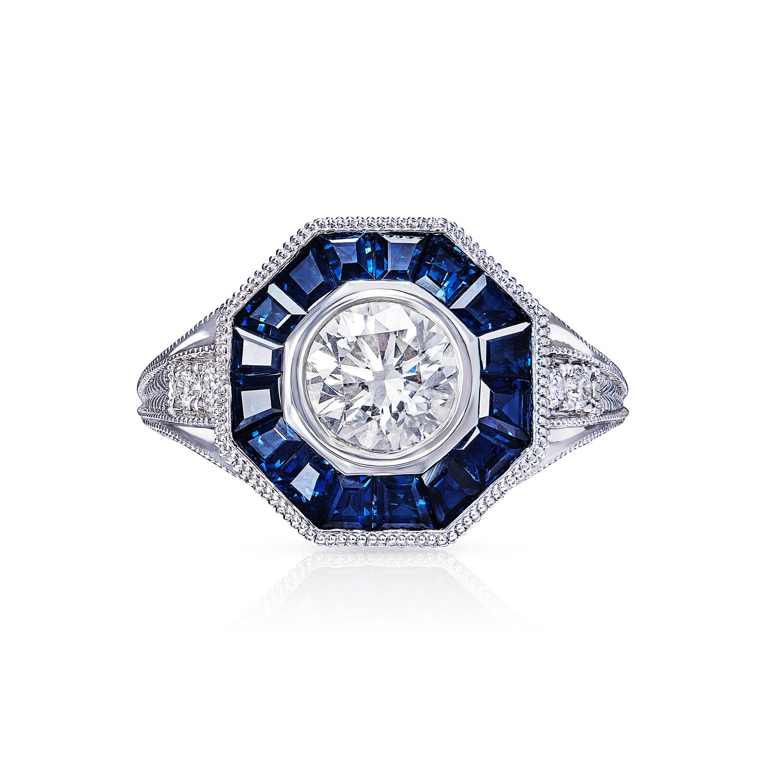 This elegant  vintage style octagon diamond ring is certified, ensuring that it meets the highest standards of quality. The round centered diamond is set in a classic four-prong setting and is surrounded by a halo of smaller diamonds, which enhances